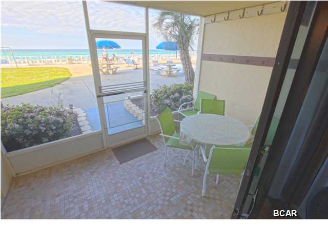 Price reduced to sell on this popular rental and 2nd home located on the desirable ground floor. 2BR/2BA condo overlooks the gulf and pool with gulf front bedroom.  Crown moulding and tile throughout set this condo apart and there is even a washer and dryer for your convenience.  Enjoy the view from your screened in patio, stroll out for a refreshing drink at the Tiki Hut, and never worry with elevators. Once the sun goes down there is still plenty to do at Regency Towers; grill out for dinner or enjoy the recently updated fitness center, billiard room, tennis courts, pool and hot tub and more will keep everyone entertained within the gated resort.  All information is believed to be correct but should be verified by Buyer.