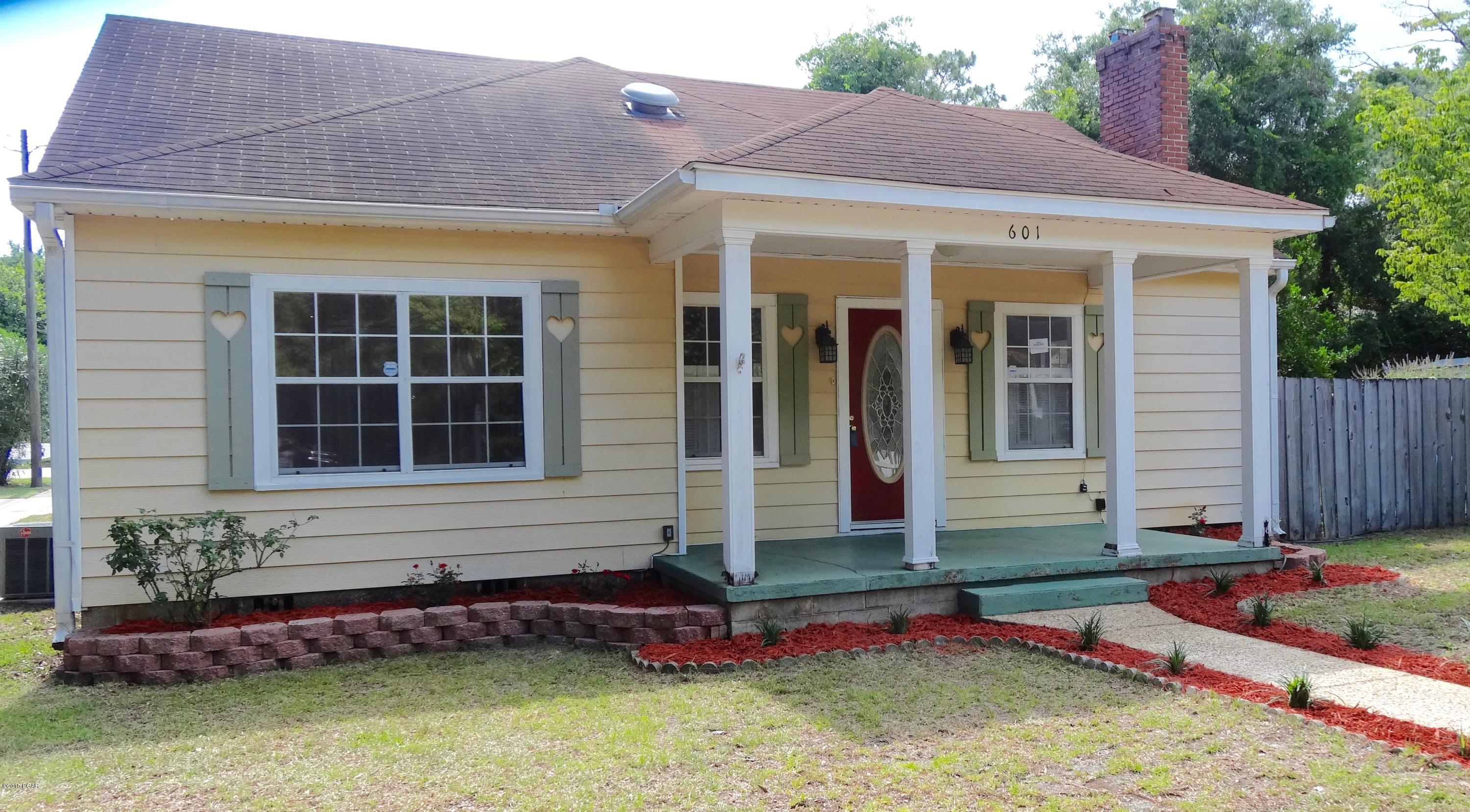 Florida cottage in the heart of Panama City. Just down the road from Bay Medical Center and Historic Downtown, which is the home of the Panama City Marina, Marina Civic Center, First Friday Events, Christmas Parade, etc. The home is cute with an open floor plan, many updates, remodeled kitchen and dining room, hardwood floors, upgraded windows, and fireplace. There are two small bedrooms upstairs that could also be an office or hobby room. There is a single car garage with workshop and a large fenced backyard. The home sits on a corner lot within walking distance to Massalina Bayou. Age, Square Footage, and room sizes approx, if important please verify.