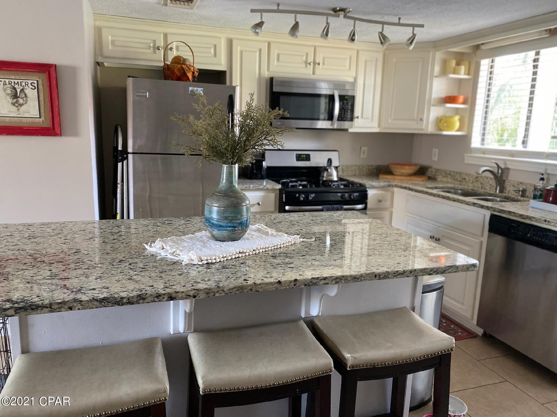 'CURRENTLY UNDER CONTRACT, SELLER ACCEPTING BACKUP OFFERS'... WALK to THE BEACH ~ 2 BR Townhome with 2.5 Baths on the CANAL in Gulf Highlands Beach Resort, it is a GATED RESORT in the HEART of PCB and is in Walking Distance to several Attractions, Dining, Shopping, Post Office, and Walmart.  HOA $700/Qtr = $233.34/mo and include Household Trash, Basic Cable, Internet, Lawn Mowing, Sprinklers, Some Pest Control, Termite Bond, and the Amenities... 11 Pools ''5 Heated'', 4 Tennis Courts '' 2 Lighted'', Fitness Center, 18 Hole Mini Golf, 2 Playgrounds, Shuffleboard Courts, Conference Center, and a Private Club House with a Snack Bar on The Beach along with 1 of the 11 Pools. The Exterior of the unit has to be painted by Nov. 1, 2021. Age, S/F, and Dimensions are approximate... Please verify