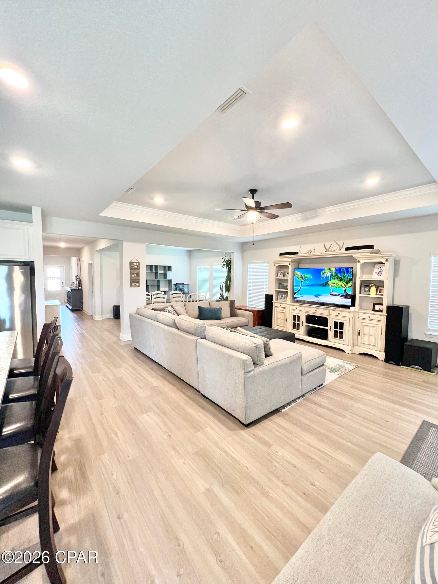 Welcome to 352 Grafton Street, a beautifully cared for one owner home located in the desirable, golf cart friendly Fanning Bayou community of Southport. Situated on an expansive 0.33 acre lot, this impressive 4 bedroom, 3.5 bathroom residence offers 2,785 square feet of thoughtfully designed living space and plenty of room to enjoy the relaxed coastal lifestyle. From the moment you step inside, you'll appreciate the spacious layout and attention to detail. The welcoming foyer leads to a dedicated study that makes an ideal home office, along with a formal dining area and expansive gathering room that provide plenty of space for entertaining family and friends. The light filled kitchen features a charming breakfast nook and flows naturally toward the covered rear porch, creating an inviting space for morning coffee, outdoor dining, or relaxing at the end of the day. The private primary suite is tucked away at the rear of the home and offers a peaceful retreat with a spacious bedroom and spa inspired bathroom featuring dual vanities, a deep soaking tub, private water closet, and generous walk in closet. Three additional bedrooms provide plenty of space for family, guests, or hobbies, while the oversized 3 car garage offers exceptional storage for vehicles, golf carts, boats, bikes, and all of your recreational gear. Outside, the large lot provides room to enjoy the beautiful surroundings while the Fanning Bayou community offers an incredible lifestyle with resort style amenities including a community pool, covered picnic area, gazebo, and playground. The golf cart friendly neighborhood makes it easy to enjoy the community and its laid back atmosphere. Conveniently located just minutes from Lynn Haven and the shopping, dining, entertainment, and amenities of Panama City, 352 Grafton Street offers the perfect combination of space, comfort, privacy, and coastal living. If you've been looking for a well maintained home with an exceptional floor plan, oversized lot, and 3 car garage in a desirable Southport community, this one deserves a closer look.