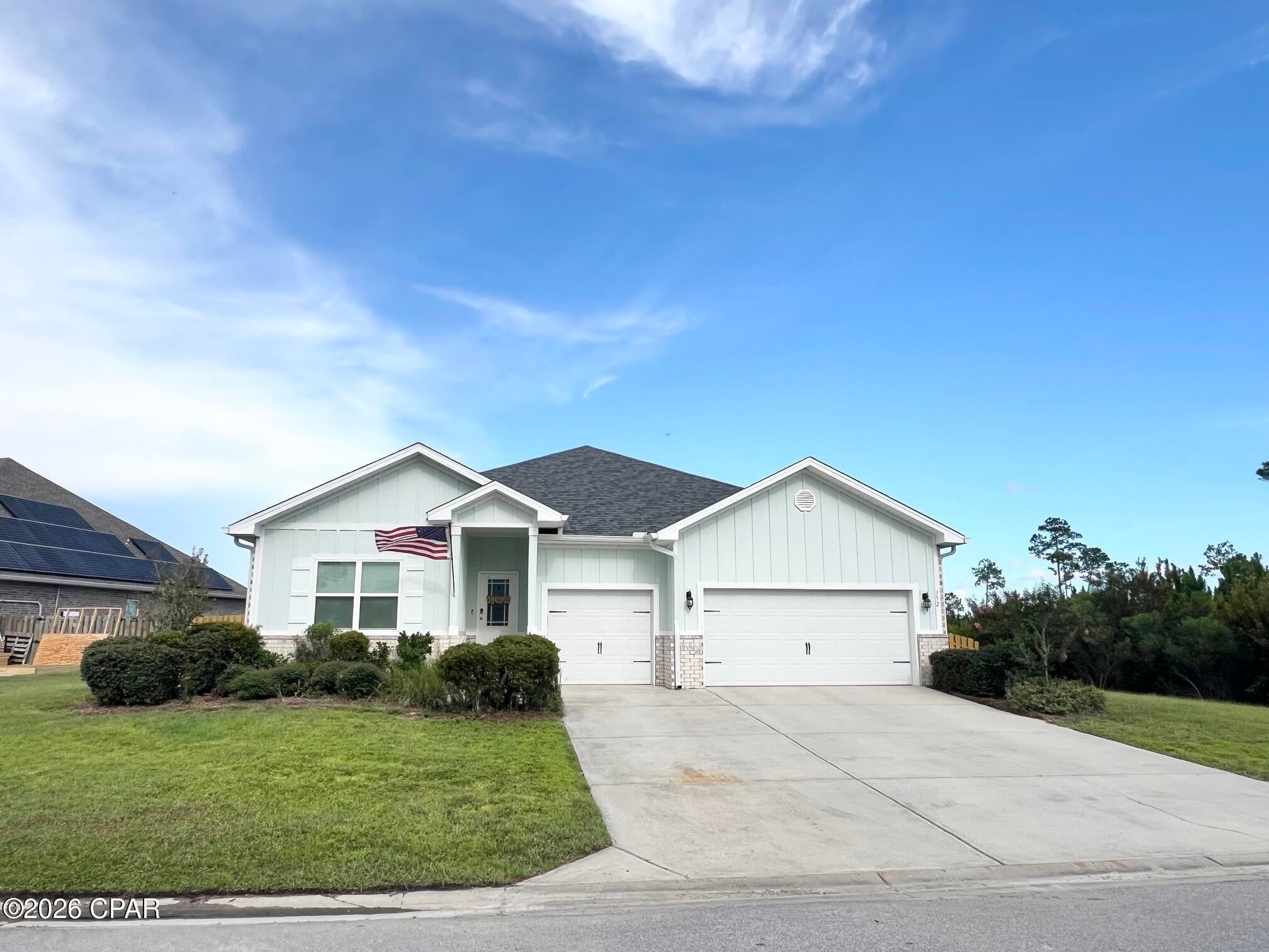 Welcome to 352 Grafton Street, a beautifully cared for one owner home located in the desirable, golf cart friendly Fanning Bayou community of Southport. Situated on an expansive 0.33 acre lot, this impressive 4 bedroom, 3.5 bathroom residence offers 2,785 square feet of thoughtfully designed living space and plenty of room to enjoy the relaxed coastal lifestyle. From the moment you step inside, you'll appreciate the spacious layout and attention to detail. The welcoming foyer leads to a dedicated study that makes an ideal home office, along with a formal dining area and expansive gathering room that provide plenty of space for entertaining family and friends. The light filled kitchen features a charming breakfast nook and flows naturally toward the covered rear porch, creating an inviting space for morning coffee, outdoor dining, or relaxing at the end of the day. The private primary suite is tucked away at the rear of the home and offers a peaceful retreat with a spacious bedroom and spa inspired bathroom featuring dual vanities, a deep soaking tub, private water closet, and generous walk in closet. Three additional bedrooms provide plenty of space for family, guests, or hobbies, while the oversized 3 car garage offers exceptional storage for vehicles, golf carts, boats, bikes, and all of your recreational gear. Outside, the large lot provides room to enjoy the beautiful surroundings while the Fanning Bayou community offers an incredible lifestyle with resort style amenities including a community pool, covered picnic area, gazebo, and playground. The golf cart friendly neighborhood makes it easy to enjoy the community and its laid back atmosphere. Conveniently located just minutes from Lynn Haven and the shopping, dining, entertainment, and amenities of Panama City, 352 Grafton Street offers the perfect combination of space, comfort, privacy, and coastal living. If you've been looking for a well maintained home with an exceptional floor plan, oversized lot, and 3 car garage in a desirable Southport community, this one deserves a closer look.