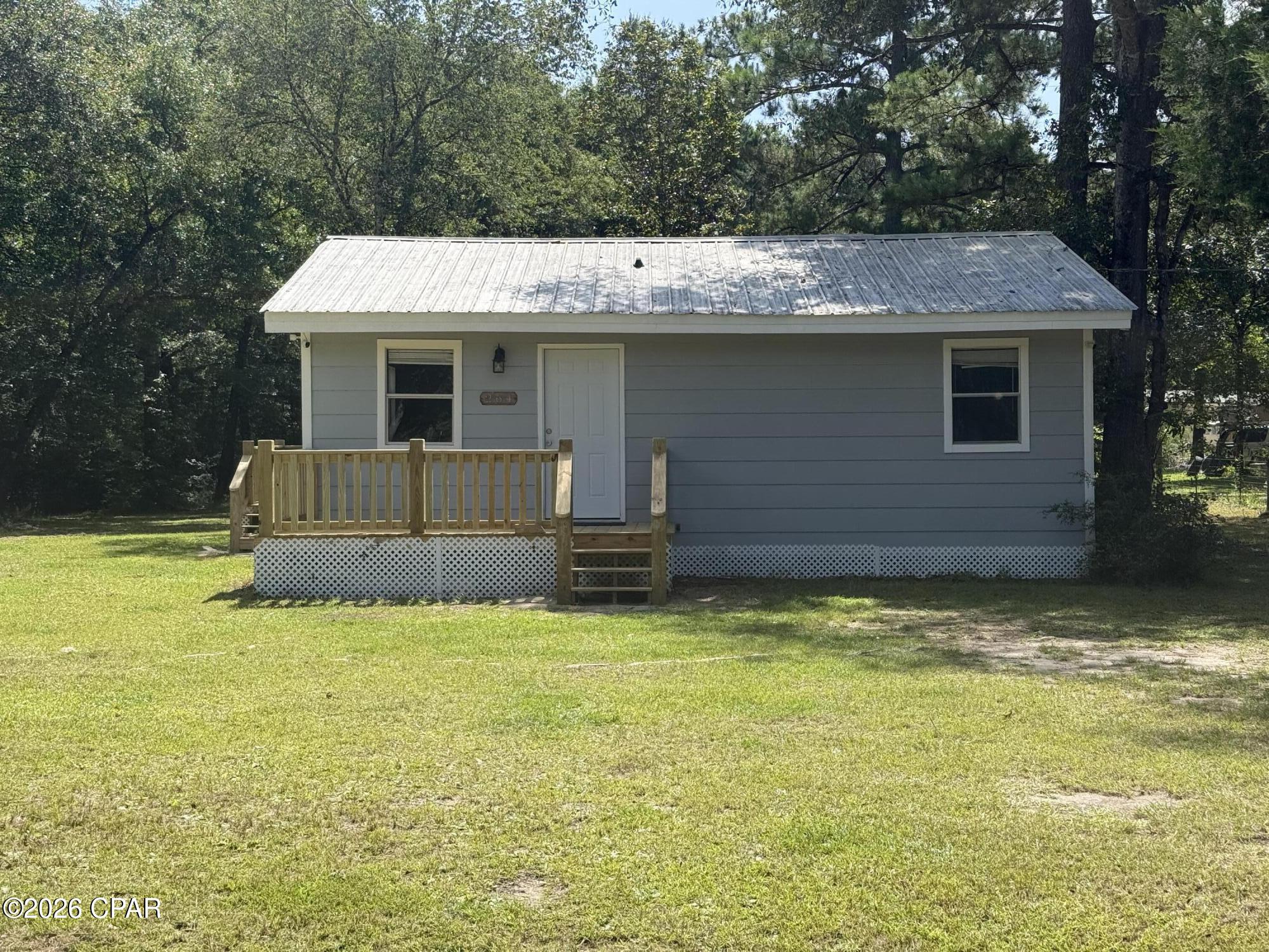 Investor Opportunity - 2 Homes on 1.50 Acres!  Rare opportunity to own two separate homes on two adjoining parcels, being sold together only as package deal for $199,900! Whether you're looking to expand your investment portfolio, live in one home while generating rental income from the other, or create a multi-generational living arrangement, this property offers outstanding flexibility and value.

The primary home at 264 Rodger Nelson Road is a charming 2-bedroom, 1-bath cottage offering approximately 840 heated square feet. Built in 1986, it features a durable metal roof, new front and side porches, central heating and air, and is served by well and septic. Situated on approximately 0.95 acres, the home provides a peaceful country setting with plenty of outdoor space.

The second home at 232 Rodger Nelson Road is a 1971 mobile home offering approximately 720 square feet, with 2 bedrooms and 1 bathroom, situated on approximately 0.55 acres. The mobile home is currently tenant occupied with a tenant who would like to remain, providing immediate rental income.

Together, these properties offer approximately 1.50 total acres, 4 bedrooms, 2 bathrooms, and exceptional income-producing potential. Located in a quiet rural setting just 10-15 minutes from DeFuniak Springs, you'll enjoy the privacy of country living while maintaining convenient access to US-331, making travel to the Gulf Coast beaches or Interstate 10 quick and easy.

Cash or conventional financing only. Excellent opportunity for investors, landlords, or buyers seeking dual-home living with income potential. Schedule your showing today!
