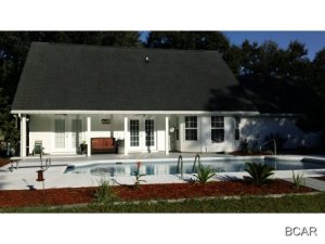 Great house in Lynn Haven with fenced backyard and inground swiming pool. Remodeled kitchen. Master bedroom downstairs and 3 bedrooms upstairs. Come and see it.