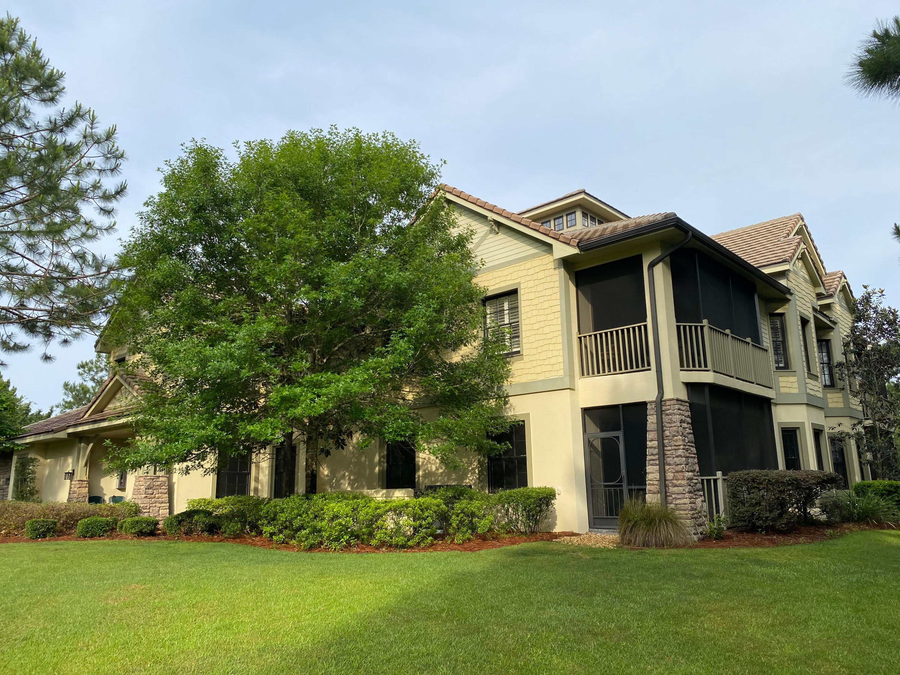 This incredible condo is located conveniently across  from the Greg Norman designed Sharks Tooth Golf Clubhouse.  This first floor condo is a 2 bedroom, 2 bath, with beautiful tile floors, a flexible floorplan with three locations to put a dining area,  Great room and a den/office, a full size double garage, laundry room, covered lanai that opens onto a large grassy area - perfect for children playing or pets.  With 8 foot doors, tray ceilings and an open plan, you will feel the expansiveness of the floorplan.   Wild Heron is a true coastal sanctuary bordering the beautiful Lake Powell that has access to the gulf.  Incredible amenities include an amazing community pool, hot tub, large gym, shower/changing rooms, covered seating, boathouse, firepit, and boat dock.  24 hr. security.