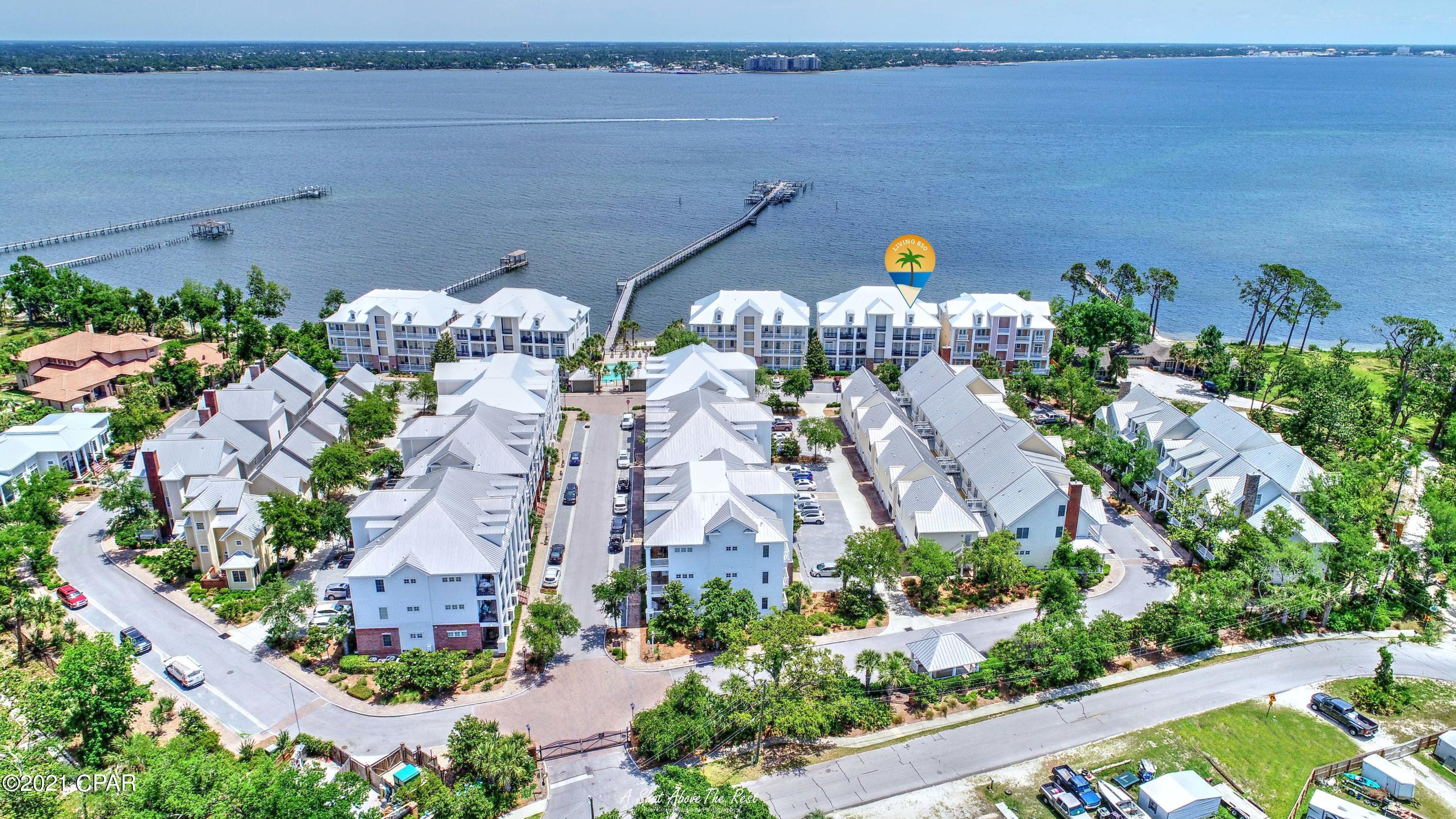 Imagine Charleston or Savannah and you can picture living at WaterHaven! This is the most charming gated Waterfront community you can find where ''Viking'' and ''SubZero'' are normal kitchen words. There is a boat launch for your use, kayaking, a gym, a community pool and movie theater. This is on St Andrews Bay close to the beach and in view of the newly re-opened Uncle Ernie's Restaurant across the BAY.  A boat slip with boat lift is available separately.  Live the dream! 

Go by boat to restaurants or to the Gulf in minutes! Enjoy this non-rental condo as a second home or as your permanent home!  See it soon because there is an elevator and this particular unit has a ''loft'' that has many options.

You are bound to love the 3 bedroom, 2.5 bath unit with a spectacular view! Waterfront!