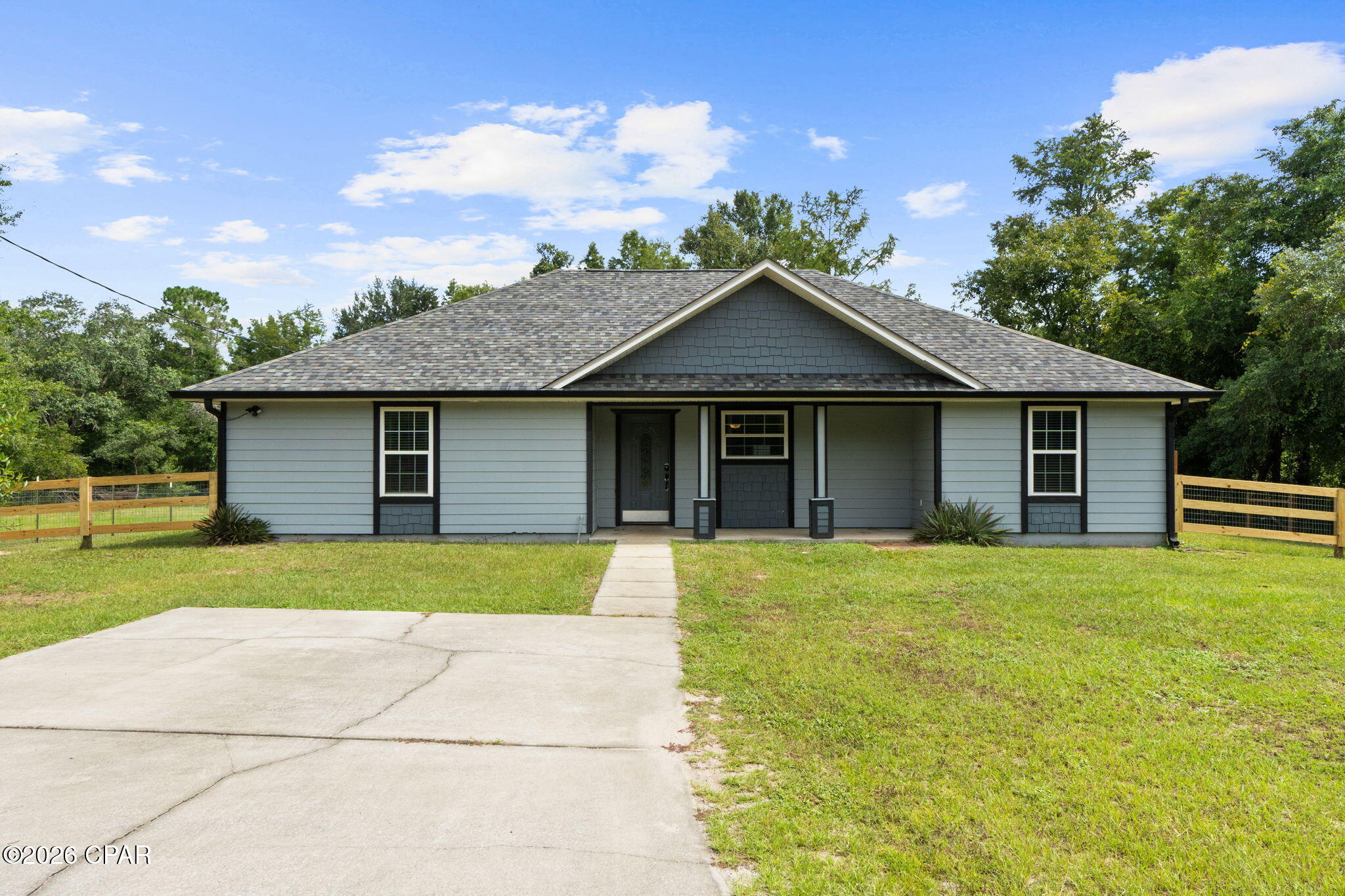 OPEN HOUSE -SATURDAY 9/5 9-12.  Tucked away at the very end of the road with no neighboring homes, this beautifully updated property offers the privacy, space, and versatility that can be hard to find. From the moment you arrive, you'll appreciate the peaceful setting and sense of seclusion, while still enjoying a home filled with modern updates and functional living spaces.
Inside, the open-concept, split-bedroom floor plan offers plenty of flexibility for everyday living. Beautiful tile flooring flows throughout much of the home, and the kitchen features wood cabinetry, granite countertops, and updated appliances. The primary suite is located near an additional bedroom, creating the perfect setup for a home office, nursery, or flex space, while two additional guest bedrooms are positioned on the opposite side of the home for added privacy.
Major updates and features add even more value, including Hardie board siding, a roof replaced in 2021, a new water heater, and appliances all updated within the last year. The home is also wired for a backup generator for added convenience and peace of mind.
Outdoor living is a standout feature of this property. The spacious 30' x 14' covered back porch includes approximately 20' x 14' of screened space, providing the perfect place to relax, entertain, or enjoy the quiet surroundings. The fenced backyard offers additional security and plenty of room for pets, play, or outdoor activities.
Need a workshop, storage, or hobby space? The impressive 24' x 36' pole barn delivers. Approximately 24' x 24' is enclosed and features spray foam insulation, a mini-split A/C system, two roll-up shop doors, plus a 10' x 16' lean-to for additional covered storage.
With its secluded setting, updated interior, expansive outdoor living space, fenced backyard, and exceptionally versatile shop, this property offers features you simply won't find with most homes or new construction. If you've been searching for privacy without sacrificing comfort and functionality, this may be the one you've been waiting for.
Buyer to verify all measurements and information deemed important.