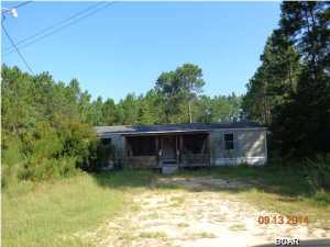 3/2 Double wide mobile home on 1 acre in Southport on paved road. You'll enter this home via a 10X18 screened porch-imagine sitting here in this country atmosphere, rocking, and sipping ice tea after a hard day at work. Come on in to a large great room with a fireplace. This opens up to the kitchen and dining room. You'll find a split bedroom floor plan in this fixer upper home. Outside, you have an acre of land that you can landscape, have a garden, orchard, add out buildings, etc. Yes, it's a fixer upper but priced right. Come see this one today. All sizes are approximate and should be verified if important.