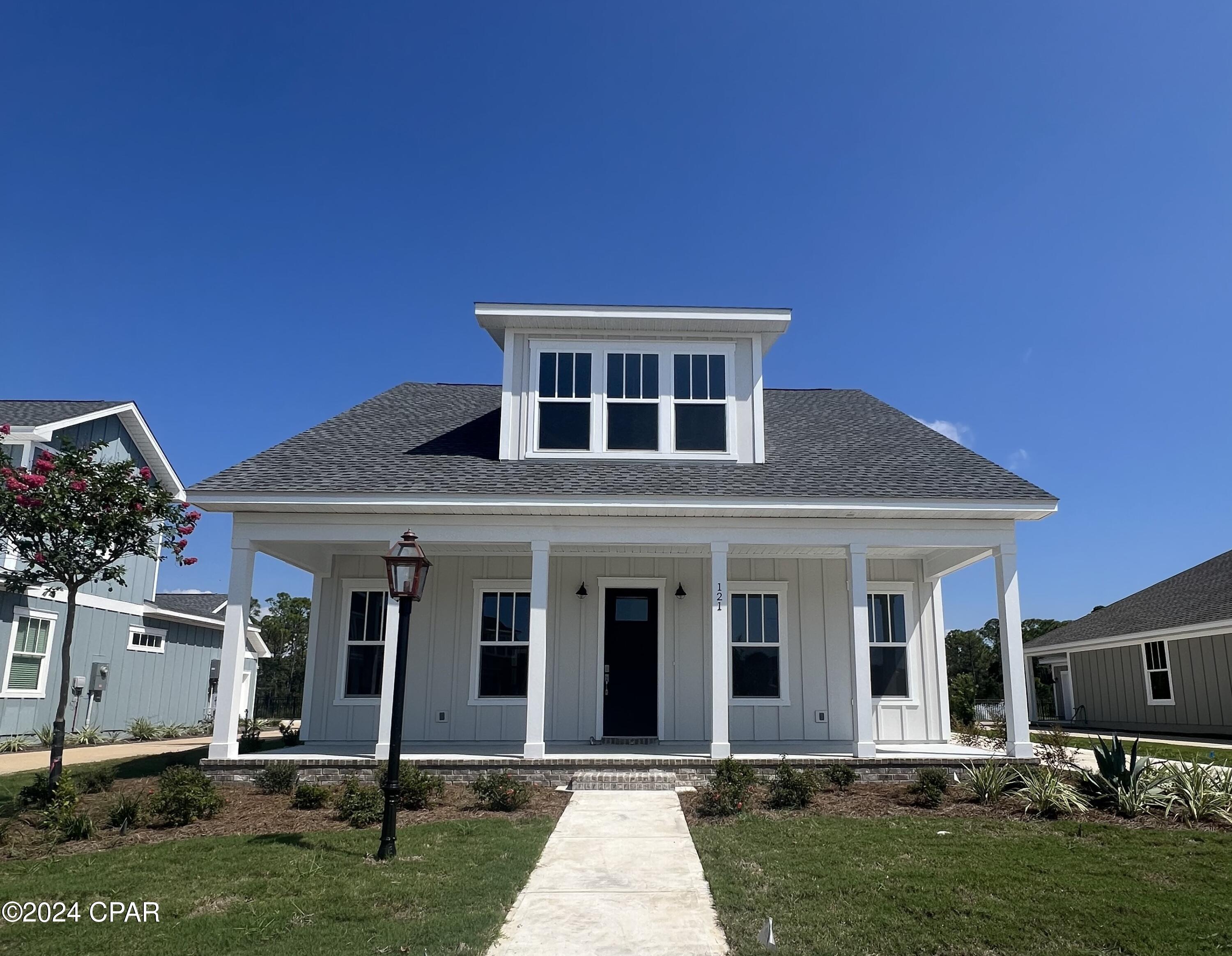 NEW CONSTRUCTION offered in the brand new Tapestry Park Phase III in Panama City Beach built by Southern Coastal Homes-2 blocks to the beaches of the Gulf of Mexico and beach access #43, close to shopping and dining, and the famous Pier Park. Homeowners have access to two community pools, lighted sidewalks and green spaces as well as access to tennis courts, basketball courts, and club house. This 4/2.5 CYPRESS floorplan is a brand new Southern Contemporary design with old Florida charm and coveted new technology and upgrades. INTERIOR large volume Great Room with an open floor plan, kitchen with center island and vaulted ceiling, custom cabinetry, walk-in pantry, pot filler and stainless steel appliances.
The FIRST FLOOR Master Suite has a beautiful tray ceiling, expansive tiled shower, double vanity and his and her walk-in closets with direct access to laundry room. The second floor holds 3 well-appointed bedrooms ample storage space. EXTERIOR features of this home include Hardie siding with beautiful brick, 8 ft doors, rear detached garage with covered grilling porch. Home includes smart lock, tankless gas water heater, energy efficient appliances, dual A/C units and has been expertly designed by our design team. 
This home is presold new construction.