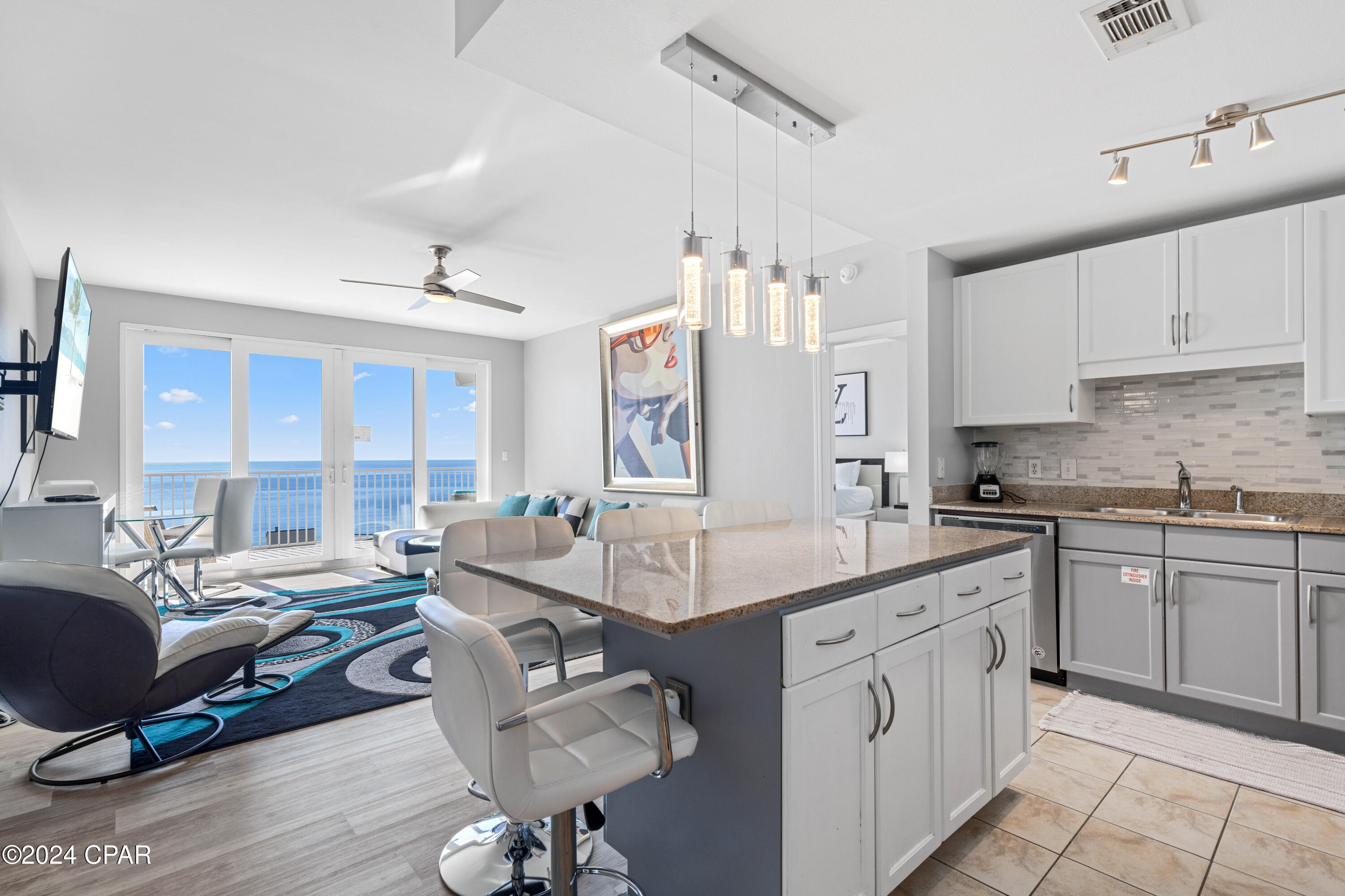 Fully renovated 3BR/2BA GULF-VIEW condo at the beautiful Laketown Wharf Beach Resort . This 1262 sqft unit offers spectacular gulf views from the 18th floor of the breathtaking Gulf of Mexico and the Emerald Coast and all it has to offer.  This unit is being sold fully-furnished and everything you see in the photos convey.  This unit is turn-key and any/all future bookings will transfer to new owner.  Gross Rental Income 2021/$67,264, 2022/$56,890, 2023/$57,975, 2024/$61,822, and 2025/$65,780.

Step into the coastal ambience of this beautifully themed condo with touches of rich blues, whites, and creams. Your kitchen gives ample space to cook up that delicious meal as you return home from the emerald coast waters and white sugary sands of the PCB coast, all just a few minutes walk, with convenient access for Laketown Wharf guests. Your kitchen features white cabinets, granite countertops and LED lighting throughout. Nestled close by you can relax on your large oversized couch, next to your electric fireplace with a large TV above. Step onto your private patio, overlooking Panama City Beach with gorgeous city and lake views below. Be mesmerized each night by the fountain and light show dancing on the lake waters below, right next to the boardwalk, where restaurants and shopping line. Soak up the rays during the day, all enjoyed in the privacy of your own balcony deck with views most dream of.

Escape to your master suite with adjoining master bath and soak your cares away in your large master soaking tub. Master bath also includes dual vanities and shower. There are two additional bedrooms with a shared bathroom, also with a shower and tub combo.

This unit sleeps 6 comfortably but can accommodate up to 8 people so it's perfect for large families and entertaining.

Laketown Wharf Resort is in the heart of all the fun & excitement of Panama City Beach. Just steps away from the world's most beautiful white-sand beaches, shopping, dining and entertainment. Amenities include: convenient beach access, 5 unique pools, a kids funscape playground, Splash Bar & Grill, Gulf View Fitness Center & covered garage parking. Laketown Wharf Offers A Variety Of views Including The Gulf Of Mexico, Lake & Golf Course. Enjoy the nightly fountain & light show & market shops along the 52,000 sqft Of Lakefront Boardwalk. HOA fees were $2783 per quarter for 2024 and are now $3002 per quarter for 2025.  HOA fees include all utilities except electric including water, sewer, cable & wifi, and access to all Laketown Wharf amenities.