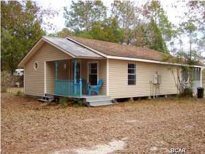 CUTE,QUAINT,COUNTRY 2/3BEDROOM COTTAGE SITS ON 1.8 FENCED/CROSS FENCED ACRES..ROOM FOR HORSES,CHICKENS,GARDENING..HAS COVERED FRONT PORCH,FRENCH DOOR OPENS INTO LIVING/DINING KITCHEN AREA(ALL HAS CERAMIC TILE AS DOES THE MASTER BATH). KITCHEN HAS NICE GAS STOVE,MICROWAVE ABOVE,REFRIGERATOR STAYS W/ACCEPTABLE OFFER. 15X12 BONUS ROOM W/HOOK UP FOR GAS FIREPLACE...NICE SIZE SCREENED BACK PORCH HAS GAS HOOK UP AS WELL. GREAT COUNTRY PLACE SO CLOSE IN AND RIGHT DOWN FROM STABLES..PEACEFUL AND QUIET..FORGOT THERE'S A STORAGE BUILDING TOO AND SURVEY!! EFFECTIVE YEAR BUILT 1990.