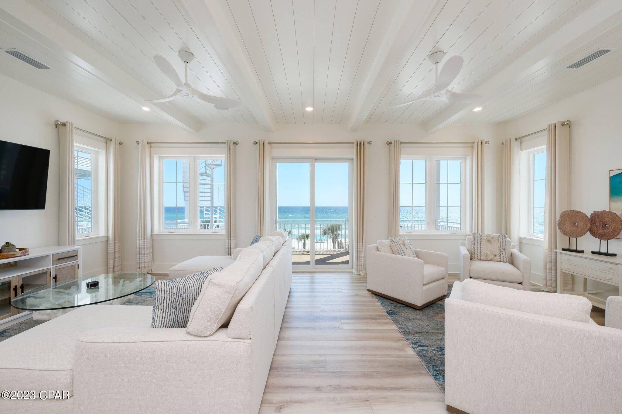 Unbelievable price on this beachfront dream home just completed, fully professionally decorated and ready for your family right now. The home is the very best Panama City Beach has to offer not just because of its stunning beach sunsets that can be enjoyed over three expansive gulf front balconies, this home is located in the new luxury Margaritaville Beach Cottage Resort. That's right Jimmy has brought us his ultimate resort experience and it comes with everything you would expect from Margaritaville. Tropical pools with bar service, water slides and lazy river for the kids, and nothing short of white glove service. If that's not enough to get you to grab your flip flops, this home features its own gulf front private pool and beach walkover. The only thing missing from this brand new stunning home is your family. Modern day amenities of this home allow for multiple generations to enjoy the beachlife, featuring a private elevator going all the way up to the third floor. Just off the pool on the first level is a great room complete with a wet bar, ice machine, full size refrigerator and a large sitting area with lots of seating, big screen tv and a foosball table. Located on this level is also a full size bathroom and bedroom. For the most stunning views of the beach this home features its living and entertaining space on the second floor. Opening up to an expansive balcony is an open concept that allows everyone to enjoy, whether you're relaxing in the deep sectional sofa, having a bite at the dining table or showing off your chef skills in the kitchen for the week featuring fresh gulf seafood, you will be sure to have a stunning view of the emerald coast's sparkling water and white sandy beach.
For the chef in the family, this kitchen is sure to not disappoint, featuring Frigidaire Professional Appliances, 36'' gas range, quartz countertops, and exquisite cabinetry. In addition to the living and entertaining space on the second level, the home also features two guest bedrooms with ensuite baths and a full size washer and dryer along with a half bath. Next on the third floor is the beachfront master suite with sweeping gulf views running east to west. Stepping out on the expansive third floor balcony allows its guest to see all the way down the panhandle's coast line. Getting ready for your day or unwinding is nothing short of luxury in the exquisite master bath, featuring a massive oversized glassed-in shower with stunning tiles and a walk-in closet. The 3rd floor also includes two additional guest bedrooms with ensuite baths, as well as another bunk area. Plenty of parking with a two-car carport, as well as three additional spaces. Owners and guests will experience the ultimate in island-inspired dining and drink options with Margaritaville's signature concepts, including The Salty Rim Bar & Grill (Now Open), Fins Restaurant and Bar (opening in 2024), and Joe Merchant's Coffee & Provisions (opening in 2024). Quench your thirst with fresh, hand-crafted cocktails while indulging in delectable entrees.Unwind in the Now Open expansive resort oasis pool, complete with private cabanas, H20 Adventure Waterslides, and a 425-foot lazy river. But that's not all! With many new amenities on the horizon, endless entertainment awaits. Engage in a friendly game of pickleball, participate in activities on the lawn, or test your skills in the indoor arcade. At Margaritaville, they cater to every preference. If relaxation is your goal, soak up the sun on the beach. If adventure is your calling, try the bike rentals or paddleboard lessons. With options to suit every itinerary, Margaritaville promises an unforgettable beach experience. Call today for additional information on the resort, rental income potential and to see this beautiful beachfront home.