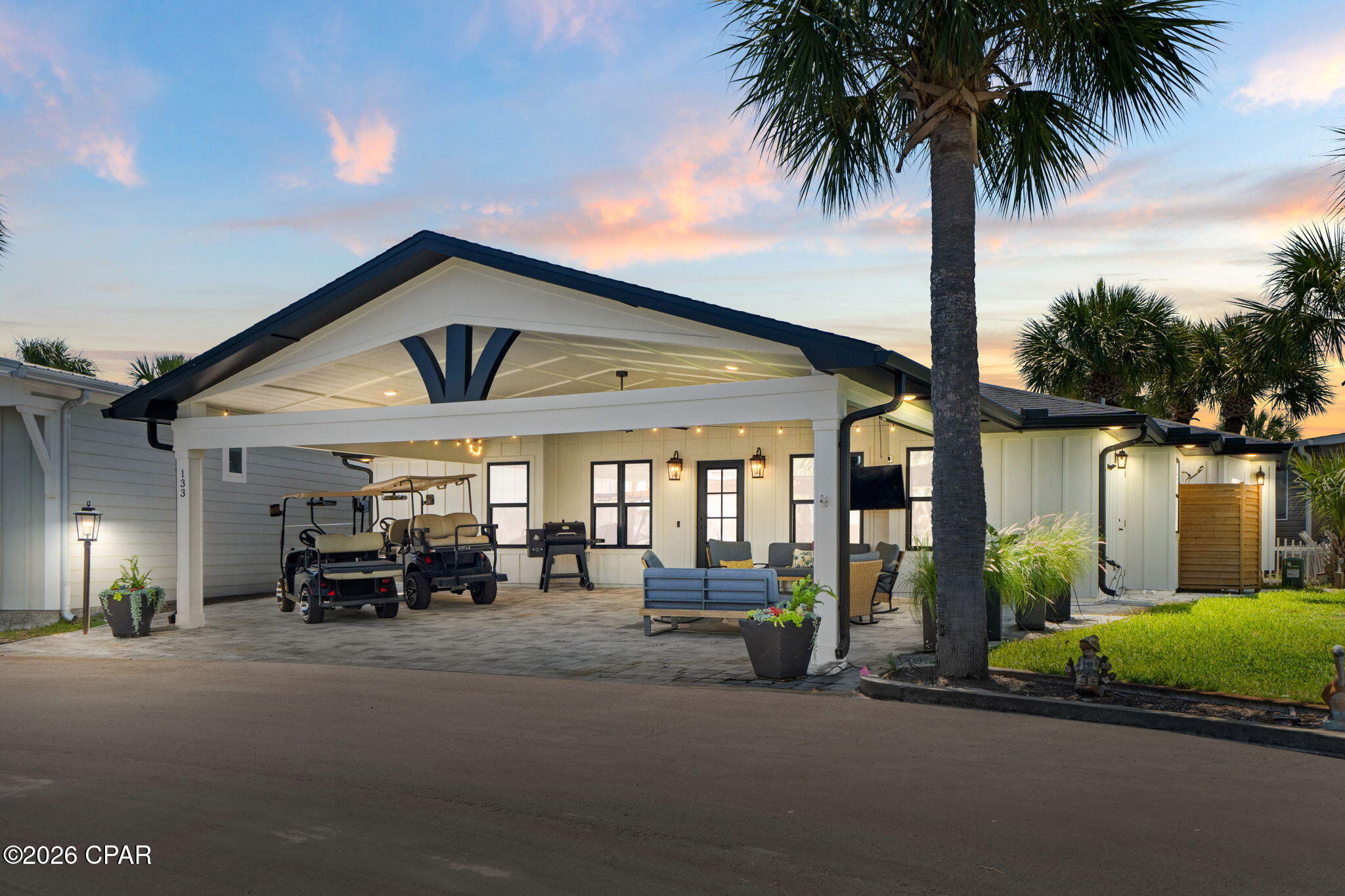 CURRENTLY UNDER CONTRACT - SELLER TAKING BACKUP OFFERS!!! This is where vacation never has to end. Welcome to Venture Out, the legendary community nestled between Lower Grand Lagoon and the Gulf of America, where nearly six decades of memories have been made on sugar-white sand and sun-warmed docks. This 2021 custom build sits on a peaceful cul-de-sac and offers 3 spacious bedrooms, 3 baths, and 1,508 thoughtfully designed square feet. The massive 28x22 covered front porch -- finished in Flagstone pavers -- is built for the way you actually live here: golf carts parked, grill going, friends gathered, sun setting. Step inside to a home where artistry meets craftsmanship. A curated coastal palette sets the tone for unique quartzite counters, an eccentric backsplash, stainless single-basin sink, Frigidaire Galaxy appliances, brick veneer and tile accent walls, high-end LVP, and an oversized living room fan that keeps the breeze flowing. Built smart with spray foam insulation, central vacuum, 3-ton HVAC, Hardie board siding, hurricane-rated windows and doors, and pocket bathroom doors that maximize every square foot. Outside your door: Gulf front pool and clubhouse with private beach access, lagoon front pool, playground, tennis courts, marina, dock, boat landing, overflow boat/trailer parking, and a private gate to Pirates Cove Marina. St. Andrews State Park, Schooners Last Beach Bar, Patches Pub and Deckhand Social are all a short walk, bike ride, or golf cart cruise away. Queen sofa bed, outside shower, laundry room, storage room, outdoor storage chest and cabinet -- and yes, the golf cart conveys. Beach lover. Boater. Both. Whichever you are, Venture Out is the answer.