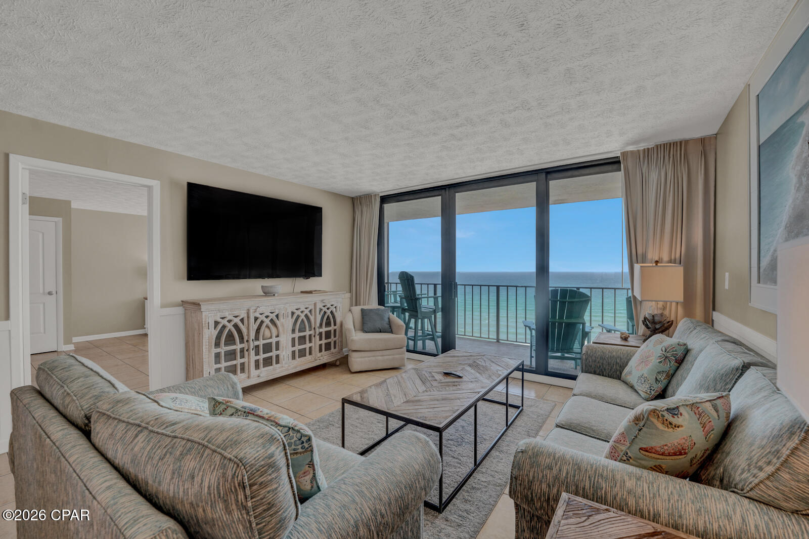Welcome to Edgewater Beach Resort, where Gulf-front living and resort-style amenities come together in the heart of Panama City Beach. Located on the 11th floor of Tower III, Unit 1103 offers breathtaking views of the emerald-green water and sugar-white sand from the living area, primary suite, and private balcony.

This spacious three-bedroom, three-bathroom condo features an open floor plan with floor-to-ceiling windows that fill the main living area with natural light while showcasing panoramic Gulf views. The updated kitchen offers attractive cabinetry, granite countertops, stainless-steel appliances, and plenty of space for preparing meals and entertaining.

The Gulf-front primary suite includes direct balcony access, a king-size bed, and a private bathroom with a beautifully updated walk-in shower. Two additional generously sized bedrooms and two full bathrooms provide comfortable accommodations for family and guests. The condo is being offered fully furnished and ready to enjoy as a vacation home, primary residence, or rental investment.

Edgewater Beach Resort is one of Panama City Beach's most established full-service resorts, offering direct beach access, multiple swimming pools, a nine-hole golf course with pro shop, tennis, basketball and pickleball courts, a fitness center, arcade, electric-vehicle charging station, onsite market with Starbucks, and Oceans Bar & Grill. The resort is also conveniently located near popular restaurants, shopping, entertainment, and family attractions.

Experience unforgettable sunsets, exceptional Gulf views, and the convenience of having everything you need within the resort at Edgewater Tower III, Unit 1103.