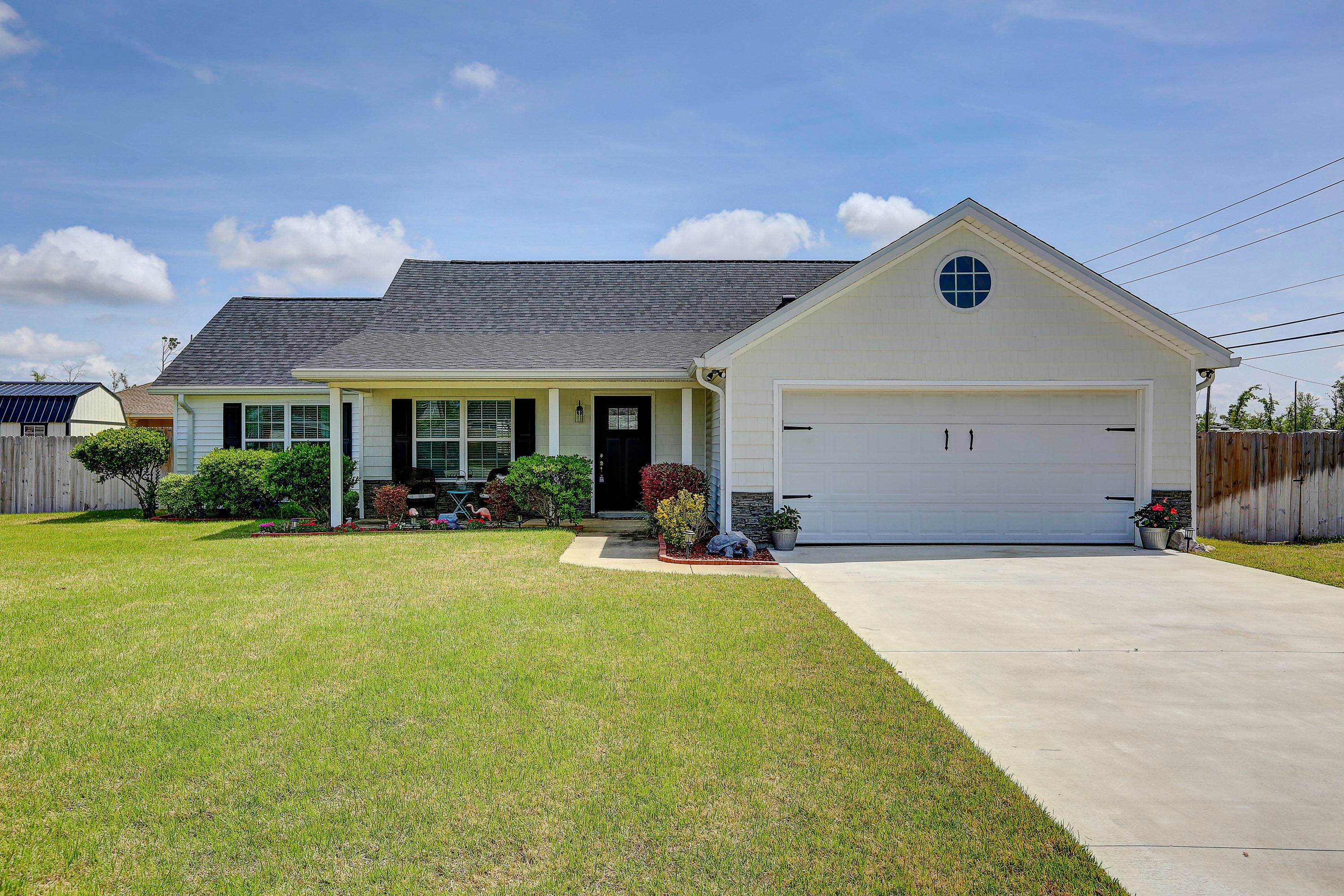 Lynn Haven 3 bedroom 2 bath move in ready home.  This corner lot home has plenty of updates to include new roof, new gutters, new insulation, new drywall, new windows, new AC, new kitchen cabinets, new granite countertops, new carpet in bedrooms, new microwave, new fence, new lighting/ceiling fans, new vinyl siding, new interior paint, new driveway and new sod in front yard.  Features include an office that opens to the living room that could be enclosed to make a 4th bedroom, master bath walk in shower, soaking tub, and double vanity, vaulted ceiling in the living room, open floor plan, breakfast bar, stainless steel appliances, pull down stairs, covered patio and sprinkler system.  The required backflow prevention device has been added.  There is a lift pump outside to assist the sewer. The property line extends beyond the back fence but the owner wanted to keep the fence in front of the drainage easement. 
Previous owner had the house re-plumbed in 2014.  This is a great neighborhood for walking and all of the neighbors look out for one another. Make your appointment to see this one today! All measurements are approximate.