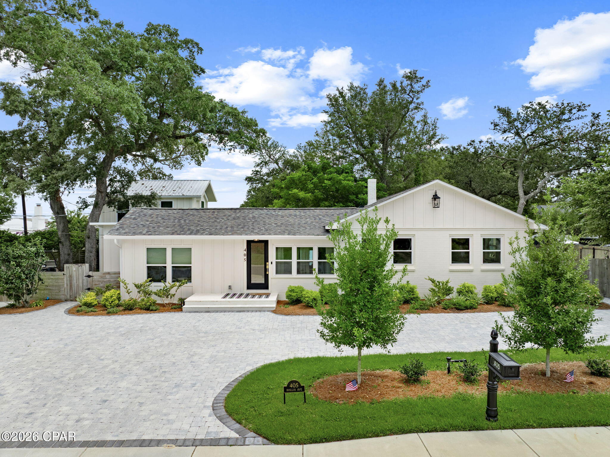 Welcome to 405 Hollis Avenue, a charming property located deep in the heart of The Cove, one of Panama City's most established and sought-after neighborhoods. Set just minutes from the Yacht Club, Downtown Panama City, and Holy Nativity School, this home offers a rare combination of character, quality construction, and flexible additional space, perfectly suited for comfortable everyday living and entertaining.

Built solid with a concrete block construction, this home has been extensively and thoughtfully updated from top to bottom. Recent improvements include spray foam insulation under the home and at the roof decking, a new AC system with all new ductwork, all-new plumbing throughout the house, and all-new electrical. A tankless gas water heater and new lighting and plumbing fixtures round out a home that's been modernized for efficiency and peace of mind, while still holding onto the character that makes Cove homes so desirable.

The main residence features 4 bedrooms and 2 bathrooms, anchored by a chef-ready kitchen finished with Taj Mahal quartz countertops, sleek matte white appliances, a natural gas cooktop, and a convenient butler's pantry. The owner's suite is a true retreat, featuring vaulted ceilings and rich hardwood oak flooring that carries the home's warm, established character throughout.

Step outside and discover one of the property's standout features -- a private heated saltwater pool surrounded by a spacious backyard that's ready for summer afternoons, weekend gatherings, and outdoor entertaining year-round.

Adding even more versatility is the separate 664-square-foot granny flat, featuring 2 bedrooms and 1 bathroom, its own washer/dryer hookup, and a private separate entrance. This additional space is ideal for visiting family and friends, a private home office, hobby space, rental income potential, or extended living accommodations.

Situated in the heart of The Cove, 405 Hollis Avenue puts you just minutes from Downtown Panama City, St. Andrews Bay, the Yacht Club, Holy Nativity School, parks, restaurants, shopping, and waterfront activities. With a fully updated main home, private heated saltwater pool, and a separate 664-square-foot granny flat all on one property, this is a unique opportunity to enjoy one of Panama City's most beloved neighborhoods.

Come experience the character, craftsmanship, and lifestyle that make 405 Hollis Avenue a special place to call home.
