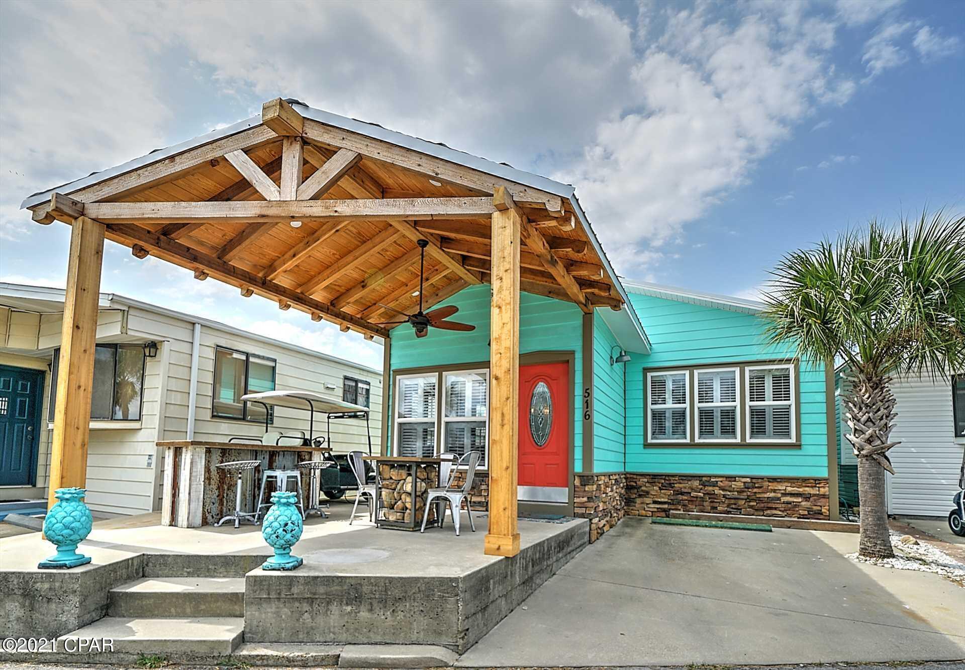 CURRENTLY UNDER CONTRACT, SELLER ACCEPTING BACKUP OFFERS -Check out this stunning Venture Out home that you must see to believe! This home has a fantastic open floor plan with a stunning kitchen and large living room. Beautiful granite counter tops, well appointed beachy decor and updates throughout make this one an easy choice. You also have an extra bunk room for the kids! All this and and excellent rental history as well.  Don't forget to let me brag about the front porch.... it's super fabulous for relaxing after a long day at the beach!  Venture Out is a golf cart community that has exploded with popularity recently... With 300' on the beautiful pristine beaches of the Gulf of Mexico and 1,000' on the Grand Lagoon. Venture Out has something for everyone. With 2 pools, fishing pier, bo
