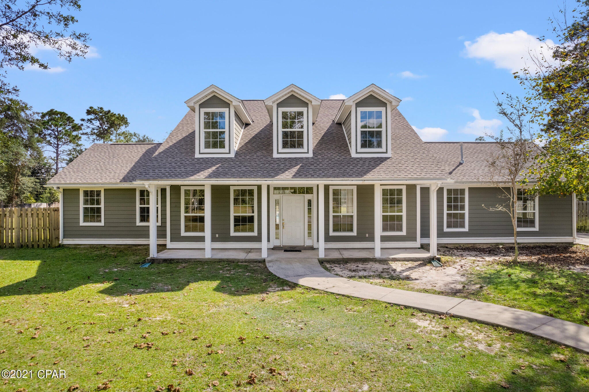 This beautiful country pool home is tucked away on a quiet completely fenced 3.63 acres, close to school,  11 miles to town, & 25 min to beaches.  250' black aluminum fencing with a double gate adorns the front of the property.  Stoneshield LVP flooring compliments the home along with ceramic tile in the laundry room and wood effect tile in the bonus room.  Recently painted. Custom built Oak shelving enhancement in bedroom #4 & the under-stairs closet.   Upgraded Carrara Laza quartz counter tops in the kitchen, new backsplash tiles, 5 burner gas stove, upgraded ceiling fans, new storage cabinet in laundry room and new quartz counter top.  Master bath has molded marble top vanity along with a spa bath and other two baths have granite.  Cool off in the summer in the custom built gunite pool. This unique pool design features 6' deep on both ends and 3' deep in the middle, along with a spa area, swim-out seats with jets, and a trickling waterfall.  A brick surround encompasses the pool filter, heater,  pool salt system, and valves to control the pool.   There are two separate a/c units, one for the first floor and one for the second floor.  Electrical supply for lamp post lights on the gate, circular drive, and RV hookup power pole are wired into dawn to dusk light sensor mount.  The shed is equipped with electrical supply, breaker panel and RV hook up has its own septic tank.  New Roof 2021, A1 Superior maintenanced HVAC along with cleaning of the ducts.  Select Home Warranty in Documents tab.   If measurements deemed important, please verify.