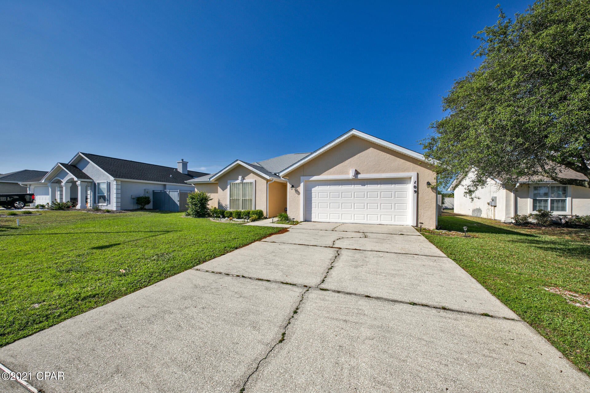 This 2BD 2.5 BA offers 2 master suites with walk in closets, a fireplace, screened in porch, fenced in back yard and a 2 car garage! The property has a new roof and water heater that was installed in 2019. Not to mention it is just a short stroll to the beach!