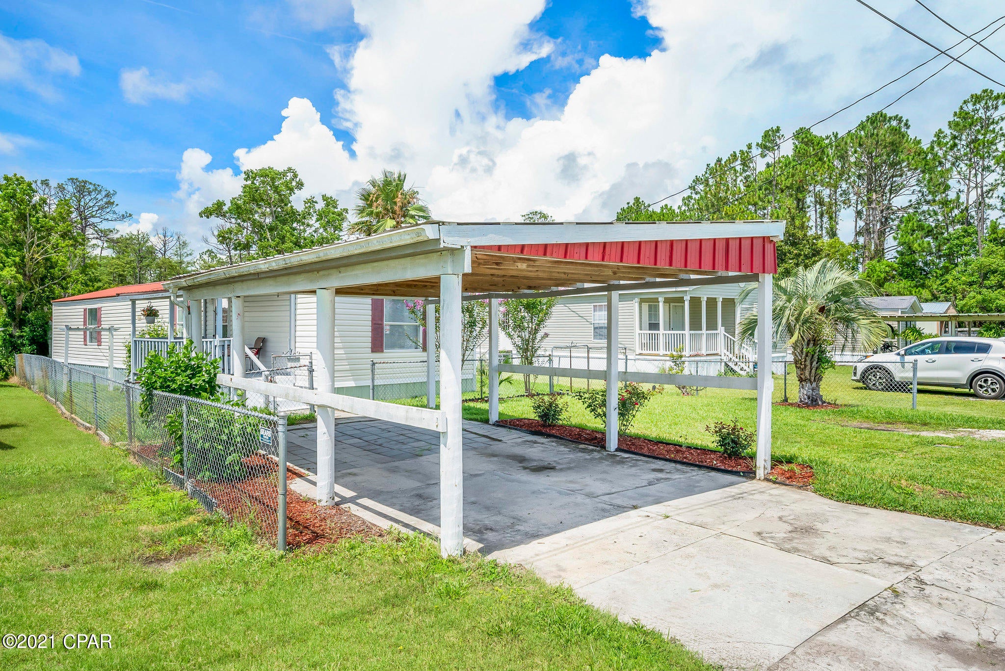 CURRENTLY UNDER CONTRACT, SELLER ACCEPTING BACKUP OFFERS' Great small family mobile home on a quiet road. The workshop in the back is perfect for storage or work space whatever you desire. Master bath has a garden tub and a stand alone shower. RV Water, power, and waste hook up. This could be a good rental or just keep it for yourself to enjoy when you come down to visit our famous white sandy beaches. Conveniently located close to Pier Park. Don't hesitate to see.