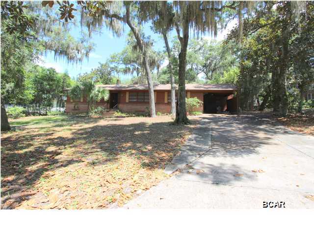 As they say in Real Estate - Location, Location, Location - and 603 Bunker's Cove certainly has it. This solid home sits in one of the most coveted neighborhoods in Bay County among the majestic Oaks and Magnolias and is close to Downtown Panama City, minutes to Bay Medical Center and within walking distance to St Andrews Bay Yacht Club. This home has been lovingly cared for and upon entering you step into a huge 36 X 14 Living Room/Dining Room combination with refinished wood floors - the beautiful wood floors run throughout the home except in wet areas, which feature new tile in the kitchen & laundry room. The kitchen also has new decorative tile work & backsplash, new dishwasher, new gas cooktop and freshly painted cabinets. Just off the kitchen is the den that features knotty