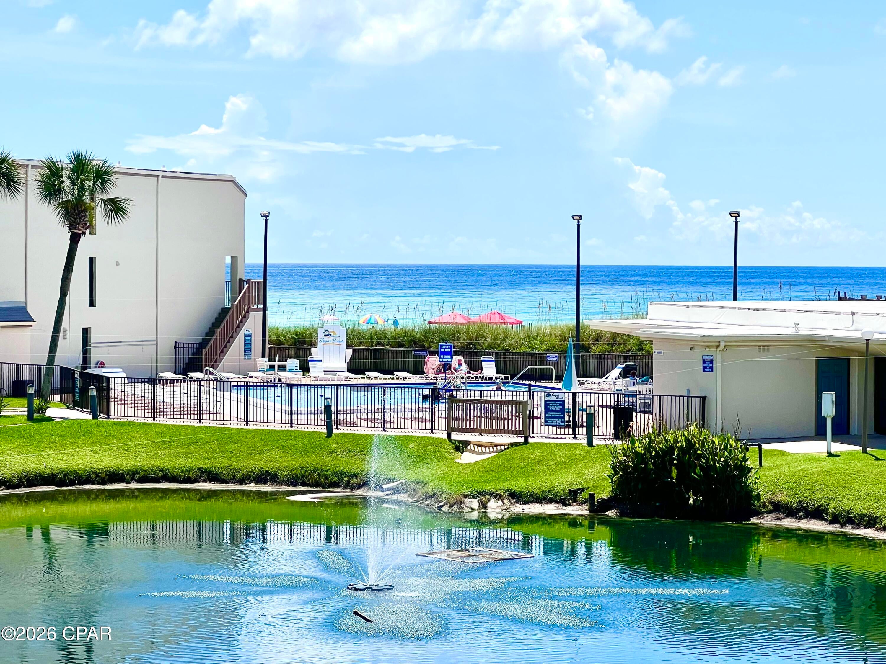 Investors Take Notice... this is the ABSOLUTE LOWEST PRICED and one of the LOWEST HOA's of all the 3 Bedroom / 3 Bathroom condos located on the beach!!!

This unbelievable condo has been loved by the same family for 27 years, and now that they are starting a new chapter in life, they are offering it up at a once in a lifetime price!

Let's look at the facts...

Maximizing rental income starts with one basic concept - maximizing ''Heads in Beds.'' And when it comes to ensuring incredible occupancy rates, this unit offers all the key amenities renters look for when booking their vacation: View, Location, Complex Amenities, and Price. 

VIEW: Most people come to PCB for the breathtaking Gulf views, and being just a few short feet to your very own private Beach Access - this condo does not disappoint. What they don't expect is to also have an incredible view over an expansive courtyard that is so well manicured, including a beautiful Koi/Turtle pond.  Sugar Beach is the only place on the beach with views like this, and they are truly unforgettable... 

LOCATION: After watching some of the world's most awe-inspiring sunsets, simply head out your front door and experience the legendary action of Thomas Drive. If you don't want to drive to dinner, rest assured knowing that your vehicle is safely parked right outside - and there is no need to drive anywhere to enjoy the best that PCB has to offer. 

Located on the coveted East end of the beach (considerably less traffic), there are go cart tracks, arcades, mini golf courses, thrill rides, ice cream shops, a winery, souvenir shops, etc. - directly in front of the property. 

For the adults, there are numerous bars/restaurants, and countless options for live music, right outside your door - including the Famous Ms. Newby's and the all new and Wildly Popular Tootsie's Honkytonk (with big name country music stars performing regularly)! No need to drive after those adult beverages, your condo is perfectly located just a few seconds away! Yep... talk about KILLER location!!!

AMMENITIES: Success in business is all about Competitive Advantage, and Sugar Beach offers something that differentiates itself from everyone else in PCB... It is one of the only PET FRIENDLY Gulf-front rental destinations in the entire area. 

Years of market data shows that pet friendly options bring a higher nightly rate, have a better vacancy rate, and are more likely to attract ''snowbirds'' during the off season, so you have true competitive advantage with this one.

In addition to being pet friendly, Sugar Beach is a private/family friendly gated community with no elevators. The list of Gulf Front complexes where you can park directly at your door are few and far between, but Sugar Beach offers exactly that! It also offers a private gated beach access, a pool, huge clubhouse with games, tennis/pickleball courts, shuffleboard, a grilling area, over 375 feet of incredible beach access, and expansive greenspace unique from every other Gulf Front property in PCB! 

PRICE: Last but not CERTAINLY not least, renters pick their vacation condo based on price. With a low selling price, low utility costs, and some of the lowest HOA's of all the competition, you have less overhead which ensures that you can charge less per night (as compared to the competition), bringing in strong rentals and generating an incredible profit!

The average 3 bedroom in Sugar Beach brings in over $60k annually in rentals, and some of the well-established ones bring in over $80k. At the high end your annual ROI would be well over 10% - which is unheard of nowadays.

And with over $90k invested in updates over the last few years, it simply doesn't get any better than this! Updates include: All new kitchen cabinets and counter tops, HVAC, water heater, electrical panel, shower inserts, LVP flooring in bedrooms, couch and loveseat, and all new hurricane sliding doors and windows. 

Welcome to Paradise!!!