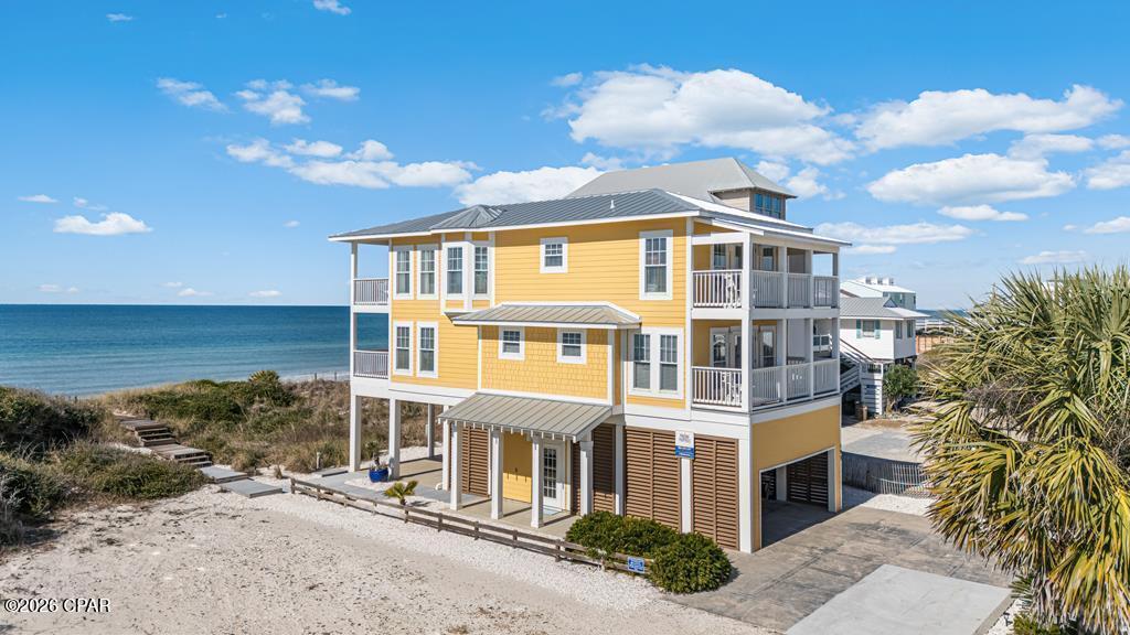 GULF FRONT CUSTOM BUILT - NORTH CAPE SAN BLAS HOME, with private beach access limited to approximately four homes, offering rare privacy and sweeping Gulf views. Built on cement pilings and finished with Hardie siding, the home features a new aluminum roof with a cable roof system, along with fresh exterior paint and caulking for added durability and peace of mind. Multiple private covered decks and a spacious patio create the perfect setting for watching sunsets, entertaining, or simply enjoying the sound of the waves. Inside, the home showcases custom Italian tile and marble, a hardwood tongue-and-groove stairwell, and a newly painted interior. The open layout is ideal for gatherings, while large locked owner closets allow for effortless transition between personal use and rental income. Recent updates include a new refrigerator, washer, and microwave. Great outdoor space with room for a hot tub and outside kitchen! The beautifully landscaped lot is thoughtfully designed with a sprinkler system, weed-mat coverage, and decorative seashells for low-maintenance coastal living. Enjoy an active coastal lifestyle with nearby bike path, kayaking, fishing, local shops and restaurants, and St. Joseph Peninsula State Park just minutes away. Whether you're seeking a strong-performing vacation rental, a second home, or a full-time Gulf-front residence, this property delivers location, upgrades, privacy, and investment potential, all in one exceptional coastal offering. Schedule your private tour today!