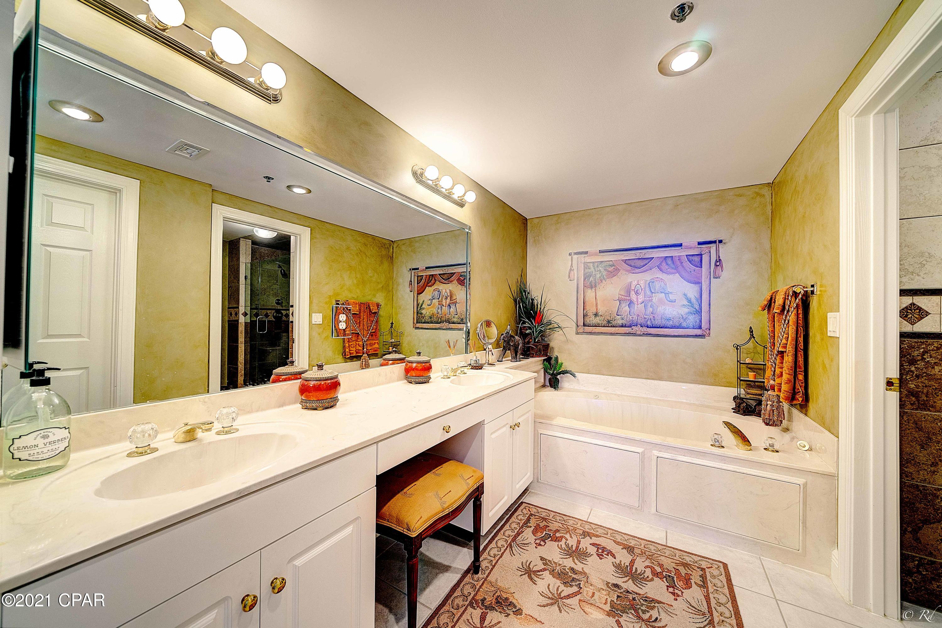 CURRENTLY UNDER CONTRACT, SELLER ACCEPTING BACKUP OFFERS - Refined luxury abounds throughout this 2384 sq ft West Indies themed 4 bedroom 4 bath condo at The Princess in Panama City Beach, FL. From the hand painted interior marble finishes on walls and columns, to perfectly weathered crown moldings, to colonial style window treatments coupled with breathtaking tile floors, there's been nothing untouched by the original artist and designer's imaginations. This generously appointed Condominium brings the true warmth of the Caribbean West Indies Latitudes to the world's most beautiful beaches. Upon entering the Foyer, one gains an open sense of the depth of this masterfully thought-out floor plan. Looking straight ahead one takes in spectacular views of open seas. From the Foyer one enters a formal dining room that's inviting with its raised ceilings and lighting that's tastefully reminiscent of the Tropics. Despite the significant size of this Condominium, from the formal dining room anyone can enjoy feeling connected to family and friends given the views into any of the four bedrooms (situated at each corner of this well laid out space), the main living area, and through an open wet bar into a highly functional kitchen.
Moving from the dining room into the main living area one discovers a richly appointed space that opens up onto a generously laid out 388 sq ft outdoor, gulf-front, living area. The main living area tile floors transition from the dining area via color and texture changes that blend splendidly to create a unique high end luxury living space to appeal to even the most discerning occupant. The hand painted and perfectly finished distressed crown moldings continue from the formal dining area to the main living room, placing a pristine finishing touch on the two distinct spaces that are tied seamlessly together to become one in the enjoyment of open gulf-front views and incredible sunsets. The balcony outdoor living space is accessible from the main living area, the gulf-front master bedroom, and the gulf-front guest bedroom. 

The master bedroom is replete with luxurious tropical touches that transport occupants to places and times filled with serenity. Marble wall venetian finishes coupled with traditional colonial tropic furnishings centered around an expansive open sea view and outdoor balcony creates the perfect space for relaxing. The ensuite master bathroom with oversized eight jet jacuzzi garden tub, dual vanities, and two person shower with five shade tone tile coupled with Kohler overhead rainshower water fixtures complete this luxury living space. 

The finely appointed gulf-facing guest bedroom with 18" earth-tone tile flooring, rich West Indies hand painted wall décor and fine furnishings combine to give guests their very own private tropical space with dramatic waterfront views. The bathroom in this guest bedroom completes the space with a continuation of the fine quality hand painted finishing touches. Sunsets from the balcony just off this suite rival those of any waterfront place on earth. 

The two additional guest bedrooms conveniently situated off of the Foyer are complete with custom décor, ensuite bathrooms, generous closet spaces and décor that compliments the entire Condominium. 

The wet bar with high capacity ice maker is situated between the formal dining room and kitchen. The kitchen has new stainless steel appliances on order and awaiting installation. Cabinets and drawers have soft close hinges. The stove top island is perfectly situated for ease of access between refrigerator, cabinets and wetbar. A mirrored backsplash enhances an open feel in the kitchen space and compliments granite countertops which run from the wet bar throughout the kitchen area. 

The expansive sliding glass doors and windows across the southern gulf-front walls of this Unit are rated to withstand up to 180 mph winds. The master bedroom contains a hidden storage safe for occupant valuables. Accompanying this luxurious condo is your own deeded personal garage for safely parking and storing that special vehicle of your choice. Newly installed stainless steel kitchen appliances and two new HVAC systems compliment the list of reasons to make this Condominium a primary or secondary residence or the perfect addition to your investment real estate portfolio. 

The Princess condominiums are located just a short distance from nearby marinas with deep water access and an almost unlimited choice of entertainment venues. Unit #603 at The Princess on Panama City Beach is exactly what you've been looking for in a Condominium. Call us directly or have your Agent reach out and schedule your private showing today. 

Private Garage Space W-15 to convey with Unit. All measurements are approximate. Buyer to please verify if important.