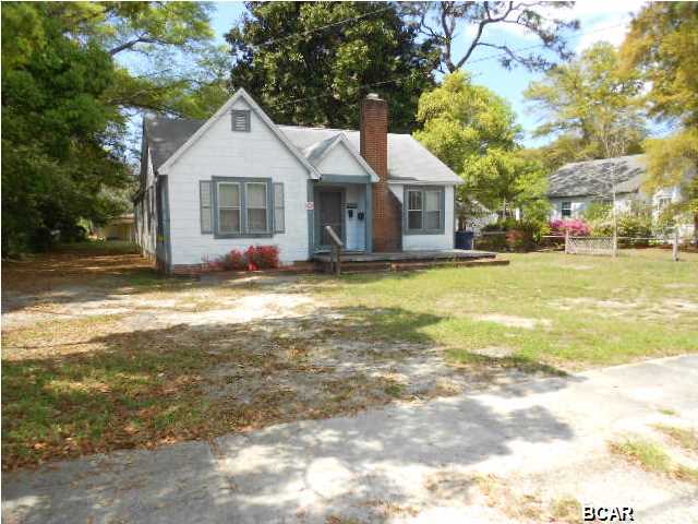 4 large bedrooms, 2 bathrooms, huge lot and a half. Walking distance to historic downtown shopping, dining, marina, civic center, St. Andrews Bay, Friday Fest, October Fest, Christmas Parade, churches, middle & high school, etc. Original hardwood floors, large rooms, plenty of parking area, alley access, wood burning fireplace and an 8x10 shed. Finish to your specifications. Zoned Mixed Use 3.
