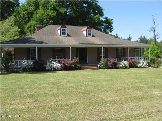 Beautiful 3 bedroom, 2 bath Ranch style home located in a well established neighborhood. Home has beautiful new bamboo flooring and ceramic tile throughout home. Large living room with surround sound and a wood burning fireplace for those cold nights. Crown molding and chair rail throughout the home with new light fixtures. Enjoy cooking in the updated kitchen with new laminate counter tops. Outside you will find a covered porch that is partially screened in. There is underground electricity that goes out to the covered carport. In case of power outage there is a generator plug on the outside of the home. Just minutes from town and the new high school. Call for your appointment today. MOTIVATED SELLER