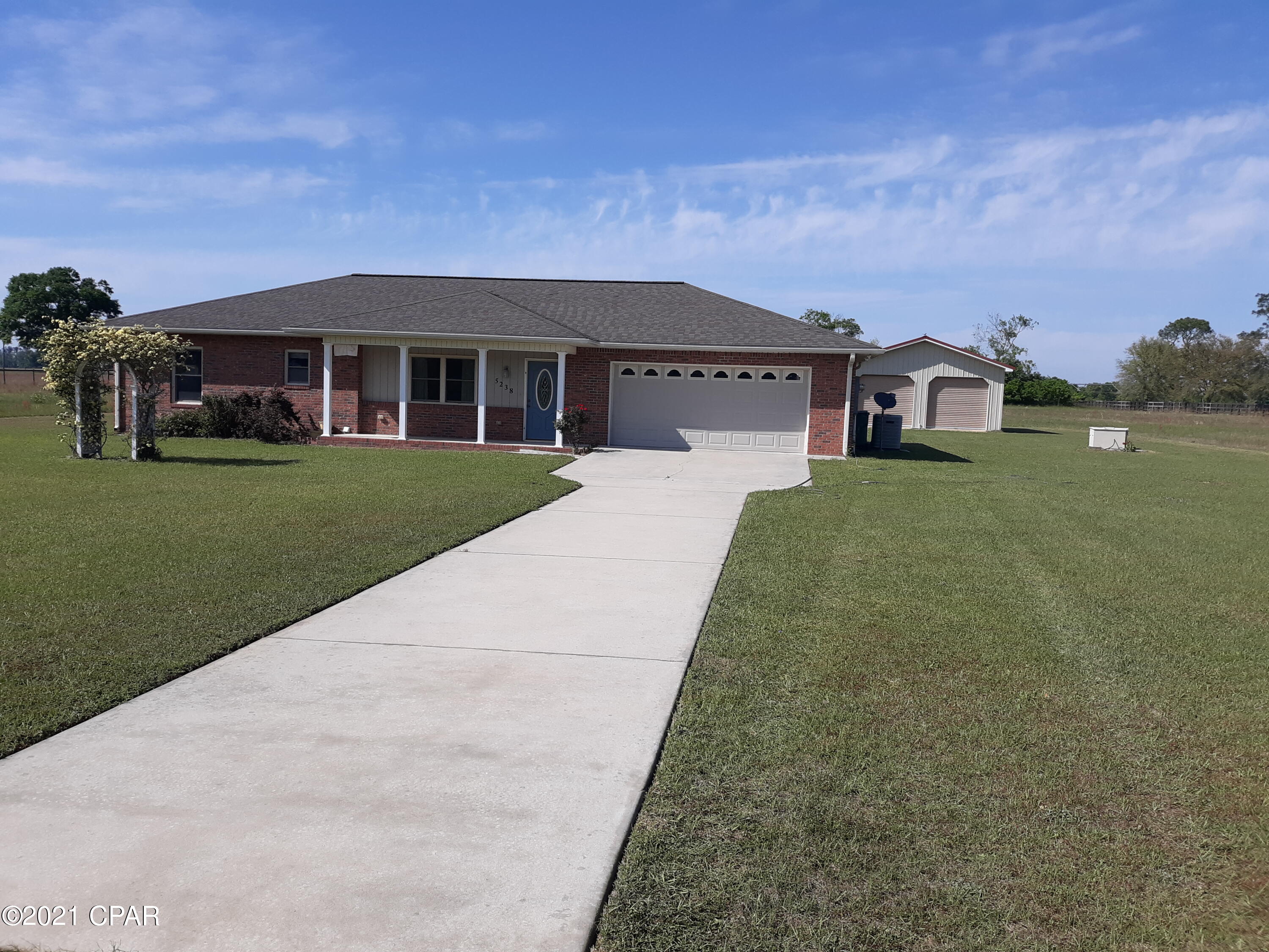 Nice brick 2 bdrm2 bath home on 5 acre's on private lane. Has new wood plank floors throughout except bdrms has new carpet. Has double garage detached in back of home along with a double garage attached to home. lot has fence around the 5 acre's and chain link fence around back yard. Nice family home large kitchen.