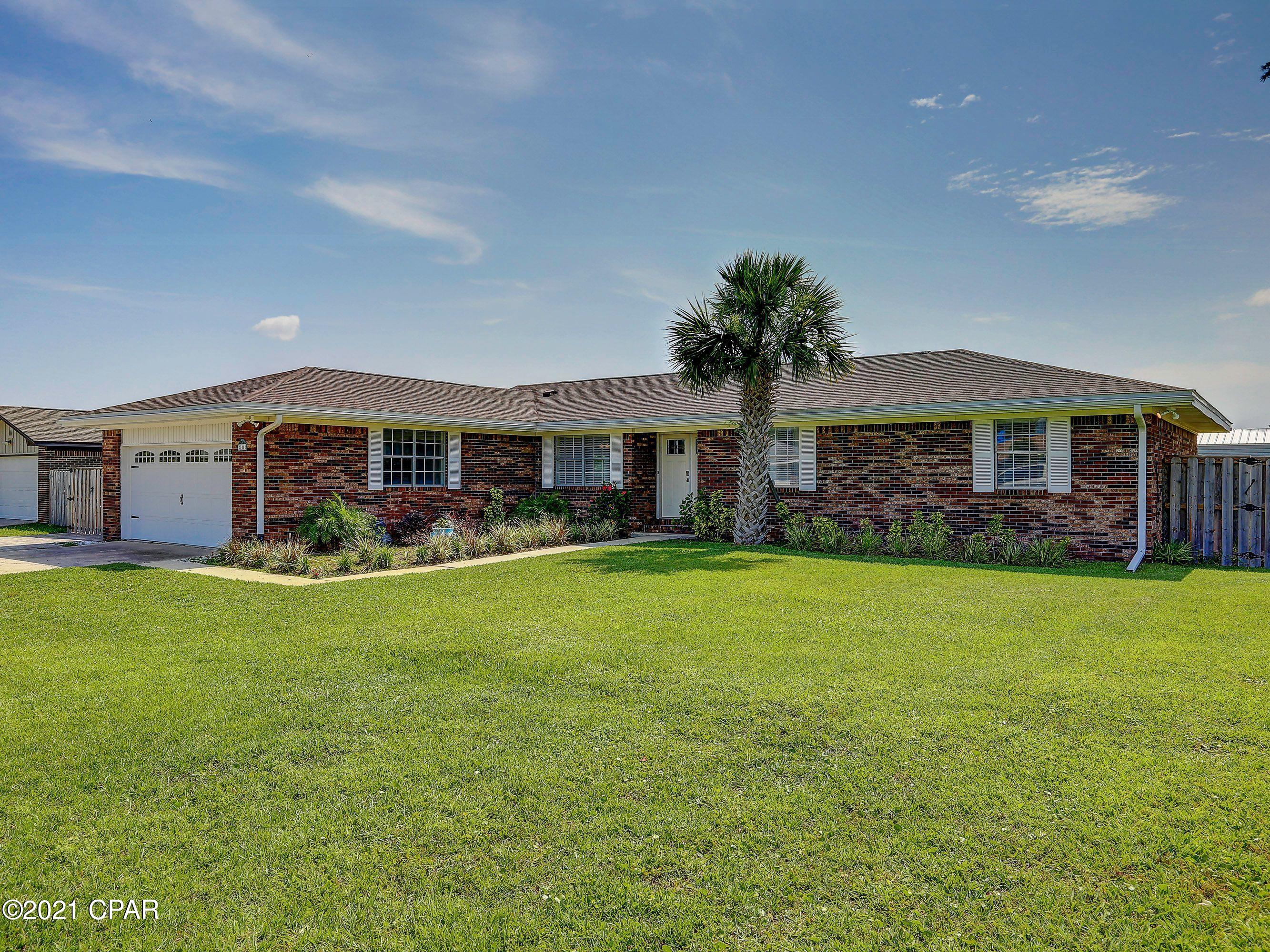 'CURRENTLY UNDER CONTRACT, SELLER ACCEPTING BACKUP OFFERS  Welcome Home and RELAX in your own personal oasis!  Conveniently located on a quiet, corner lot in Lynn Haven, minutes to shopping, restaurants, beaches, parks, boat launch, TAFB, and MORE!  This well kept brick home features a cozy fireplace in the sunken living room, an updated kitchen with granite countertops and fresh appliances!  Cool off in the recently  resurfaced gunite salt water pool or perhaps the hot tub!  Or watching the family from the huge covered porch.  3000 SF of outdoor pavers provide lots of additional parking and outdoor space.  Be confident in the recently replaced roof, HVAC system, and windows.  Do NOT delay - schedule your showing today!