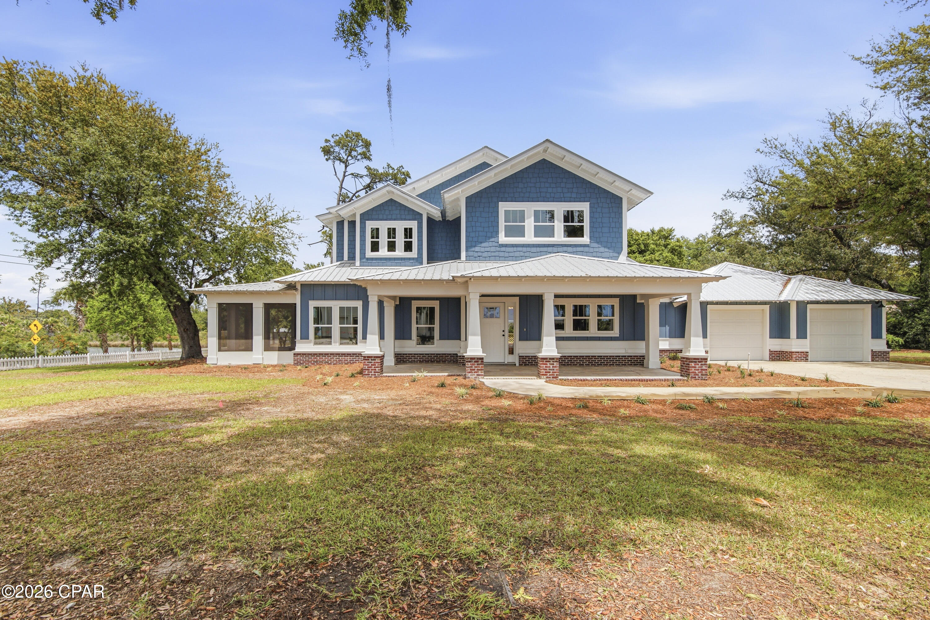 CURRENTLY UNDER CONTRACT, SELLER WILL CONSIDER BACKUP OFFERS
'The Bungalow' is a beautifully crafted new build on E. Caroline Blvd, perfectly positioned in the historic Bay Area facing W. Beach Drive. Enjoy stunning views of St. Andrew's Bay and Lake Caroline from this thoughtfully designed coastal home.

Offering 4 bedrooms, 3.5 baths, and a versatile bonus room ideal as a fifth bedroom or private retreat, the layout is both spacious and flexible. The open-concept kitchen and living area create a bright, inviting space ideal for today's family and social gatherings.

The first-floor primary suite captures both bay and lake views and includes a screened room--perfect for enjoying coastal breezes year-round.

Located just minutes from downtown, marinas, dining, shopping, and St. Andrews, this home blends scenic tranquility with everyday convenience. A two-car garage and extended driveway provide ample parking, while thoughtful planning preserves your water views.

A rare opportunity to own a coastal retreat in the historical Scenic Beach Drive area --don't miss it.