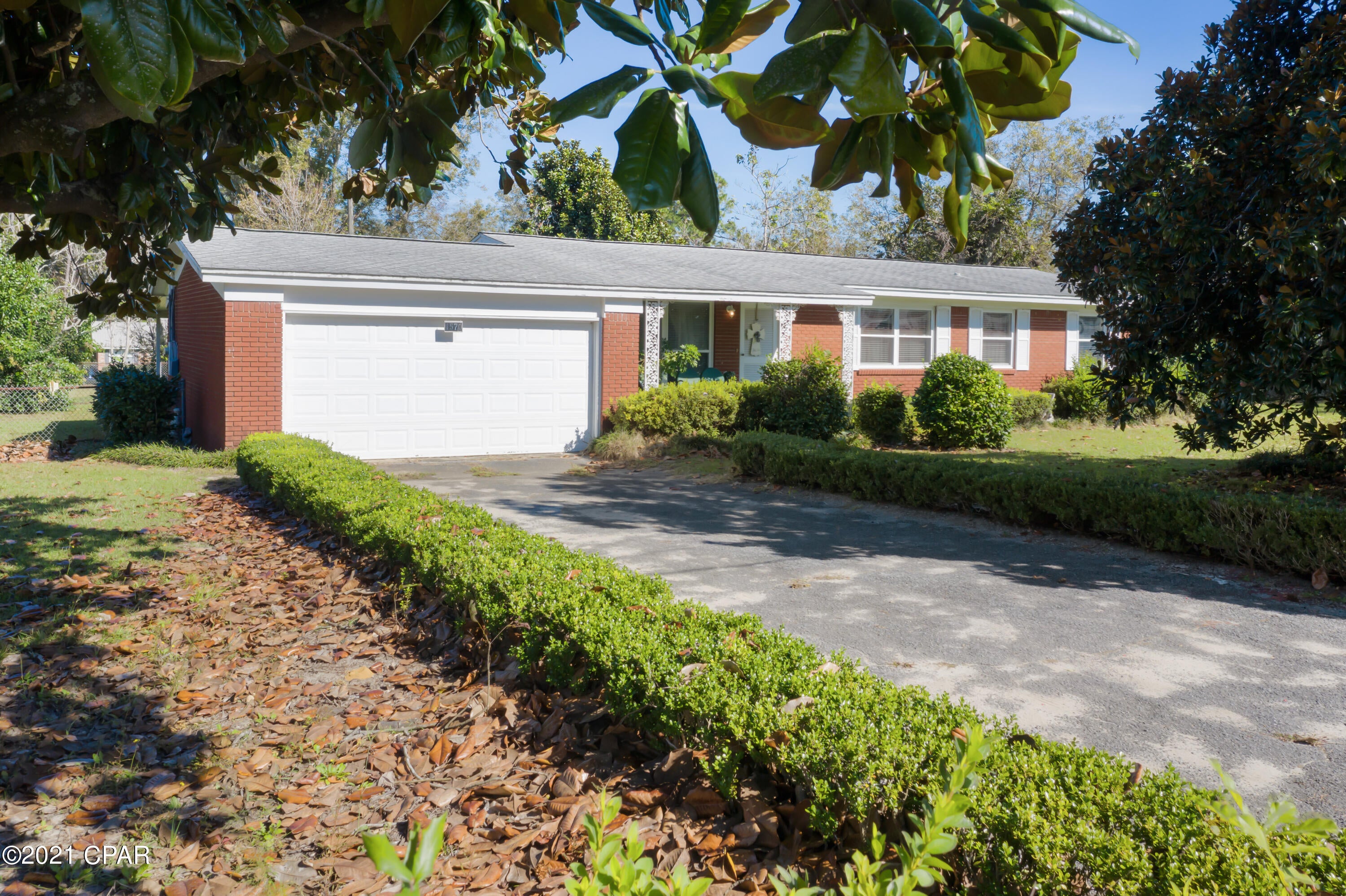 This three bedroom home is conveniently located on a paved road and has lots of original charm.  The living area is a nice size and features a brick fireplace with gas insert as the centerpiece.  The kitchen has access to both the dining area, as well as a breakfast nook.  The master bedroom suite features a full bathroom.  There is an additional full bathroom in the hall that is accessible to the two additional bedrooms.