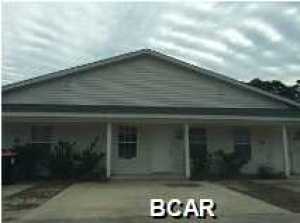 Two bedroom two bath triplex located in the North Lagoon are, and only minutes to the beach. Unit is a split bedroom with tile kitchen, dining and bathrooms, and vaulted ceiling in living room. New carpet and paint.