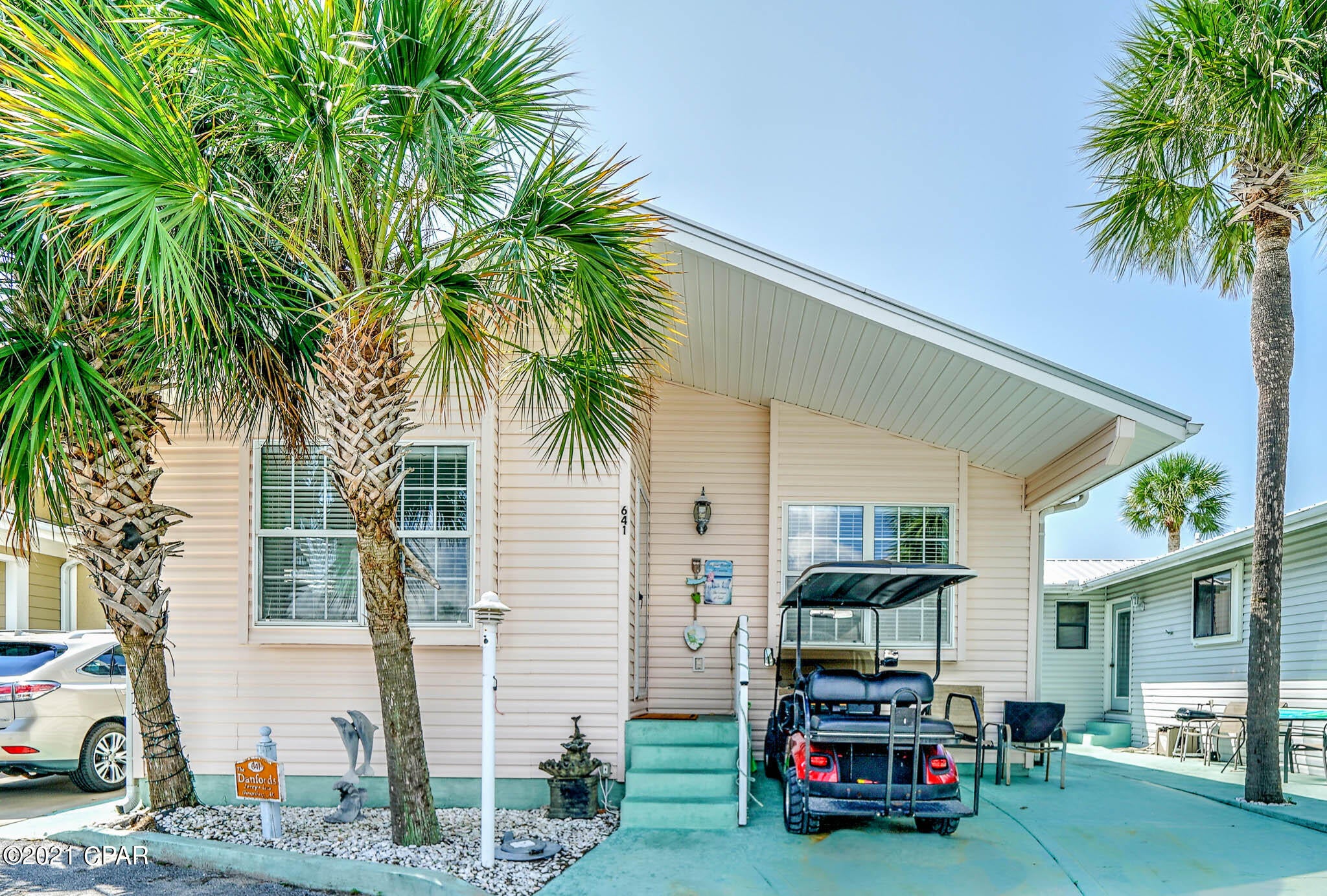 CURRENTLY UNDER CONTRACT, SELLER ACCEPTING BACKUP OFFERS - Check out this stunning 3 bed, 2 bath Venture Out home! This home has a fantastic open floor plan with a stunning kitchen and large living room. Beautiful granite counter tops, well appointed beachy decor and updates throughout make this one an easy choice.  Seller has just added new flooring, counter tops and paint.  Venture Out is a golf cart community that has exploded with popularity recently... With 300' on the beautiful pristine beaches of the Gulf of Mexico and 1,000' on the Grand Lagoon. Venture Out has something for everyone. With 2 pools, fishing pier, and much, much more!!