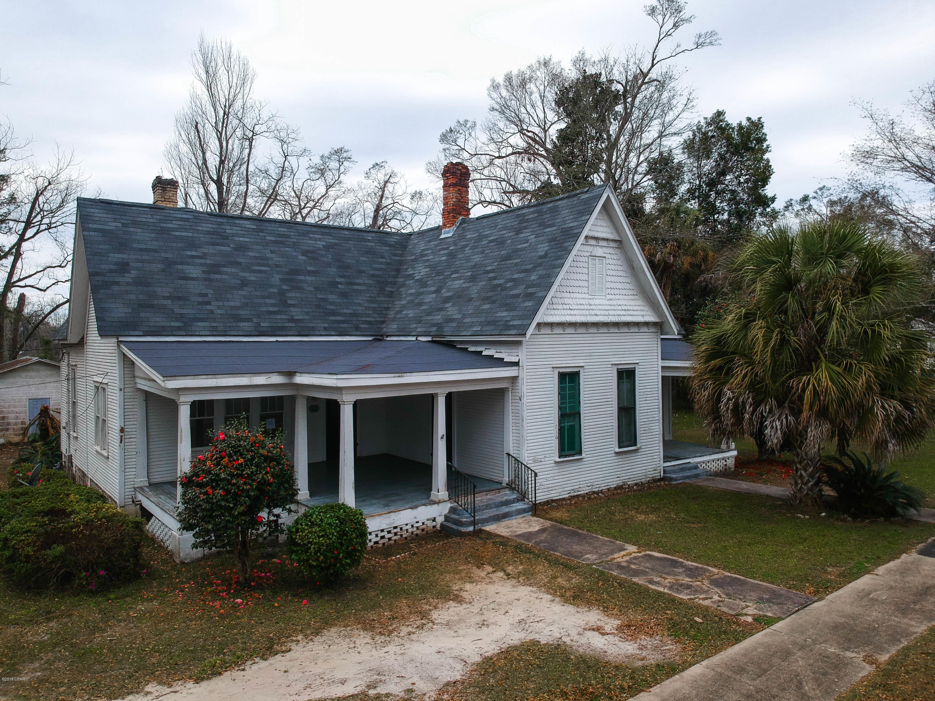 A wonderful historic home in the heart of downtown Chipley and on Historic Third Street. Four (4) bedroom, two (2) bathroom property with three (3) fireplaces inside the house. A sunroom, french doors, and beautiful windows to let in that sunlight! The property is perfect for a fixer upper and has a new roof as of Feb. 2019. Minutes from all the shops and resturants that Chipley can offer, this property sits on a lot that is over 1 acre!  This home quailifies for Keller Mortgage Zero PLus loan. That means no origination fees or lender fees if you need closing assistant. You can save approx $3000 in closing fees over other banks. All measurements are approximate