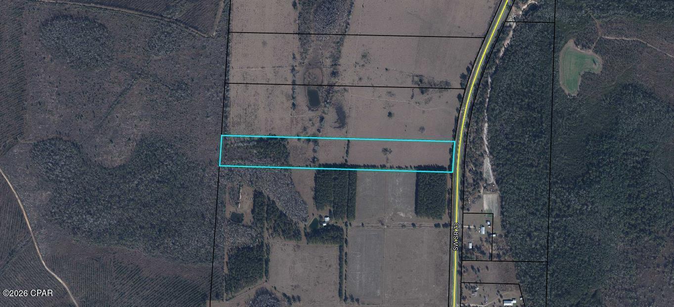 Discover the perfect blend of space, freedom, and opportunity with this beautiful 12.35± acre vacant residential parcel located along State Road 73 in Clarksville. This property features gorgeous, mostly cleared pastureland, offering a wide-open canvas for your vision and lifestyle.

With ample acreage and road frontage, the land is ideal for building your dream home, establishing a mini-farm or homestead, or enjoying a quiet rural retreat. Bring your animals—this property is well-suited for cows, horses, goats, chickens, and other livestock. The level, usable terrain provides endless possibilities for agricultural use, gardening, or recreational enjoyment.

Enjoy the peace and privacy of country living while still having convenient access to nearby towns and amenities. Whether you're looking to build now or invest for the future, this versatile parcel offers space, beauty, and potential in one exceptional package.

Buyer to verify zoning, land use, and availability of utilities.