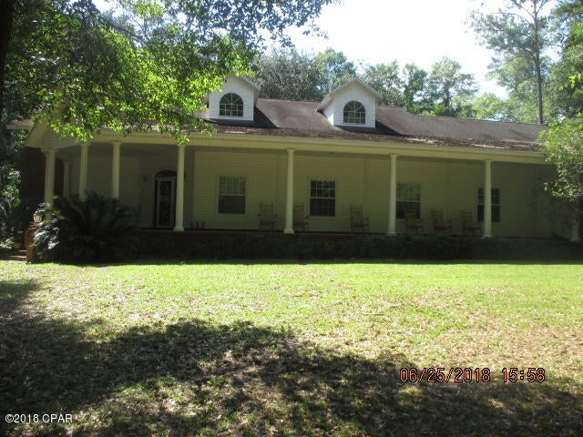 Home has damage to land from hurricane but is currently being cleared.  Home has been re-roofed.