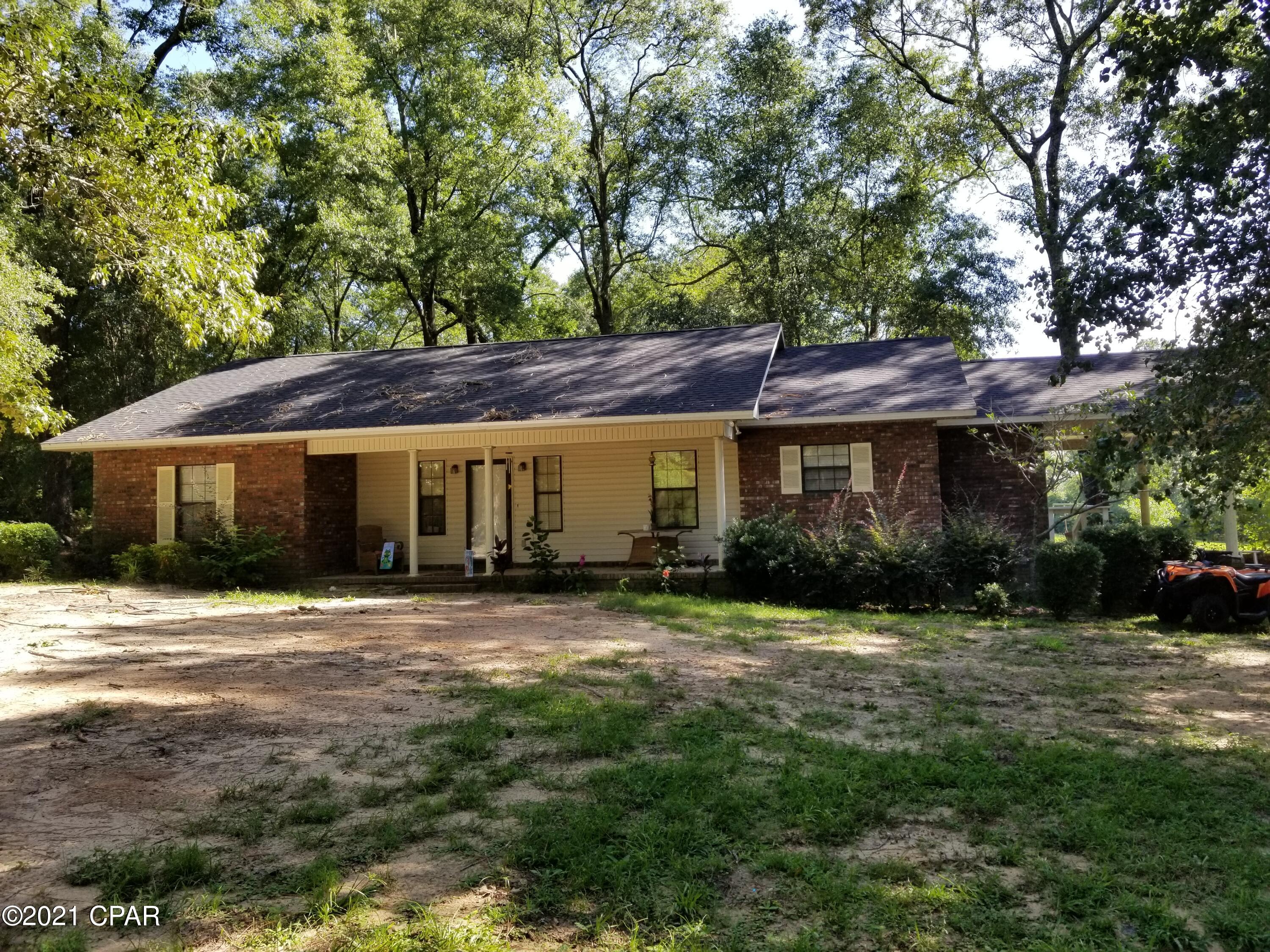 'CURRENTLY UNDER CONTRACT, SELLER ACCEPTING BACKUP OFFERS'This brick home on the golf course of Bonifay Country Club is looking for new owners. Located in the Dogwood Lakes subdivision, the home sits back off the paved road near the back of the lot adjacent to the second fairway and second green. It has some great views of the golf course. It has 3 bedrooms, 2 bathrooms, a covered front porch and a large screened in and covered back porch. It's a great place to relax or grill out. The master bathroom has a very nice tile shower, cabinet space, double vanities, and a walk-in closet. The kitchen cabinets have an oak finish, lots of counter tops and a big breakfast bar with eat-in kitchen. The family room is huge and the center of activity. The pole barn is a man's dream!