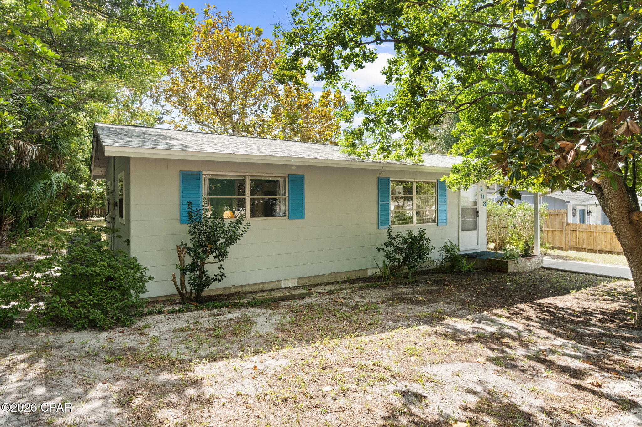You will love this Bid A Wee beach cottage located just a block from Front Beach Rd that is short term rental approved.  This furnished 2 bedroom, 1 bath home includes a living room, kitchen and dining area.  There is also a utility room with washer and dryer, connected storage and a backyard shed for more storage.  There is a large 60' x 150' yard with plenty of room to add a pool.  A carport allows you to park one car under cover.  The best part is the private, gated Bid-A-Wee beach.  For a voluntary $100 membership per year you can be supplied the gate codes to your gorgeous stretch of paradise. The roof was replaced in January 2026, HVAC is 2017 and W/H is 2021.  Zoning is R-2 Limited Multi Family.  Close to Pier Park and lots of activities such as FUNLAND, Hidden Lagoon Goofy Golf and Racetrack, Top Golf, Dolly Parton's Dinner Theater and great restaurants Sharky's, Runaway Island, and Firefly.  Call to set up your showing today!