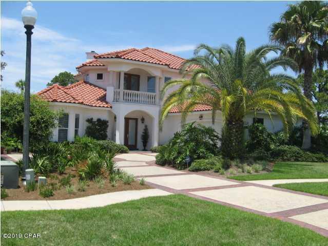 Beautiful Mediterranean style home located in the East end of Panama City Beach in the gated community Finesterre.  This two story home features expansive ceilings in the living room, fire place, 2 car garage and pool.