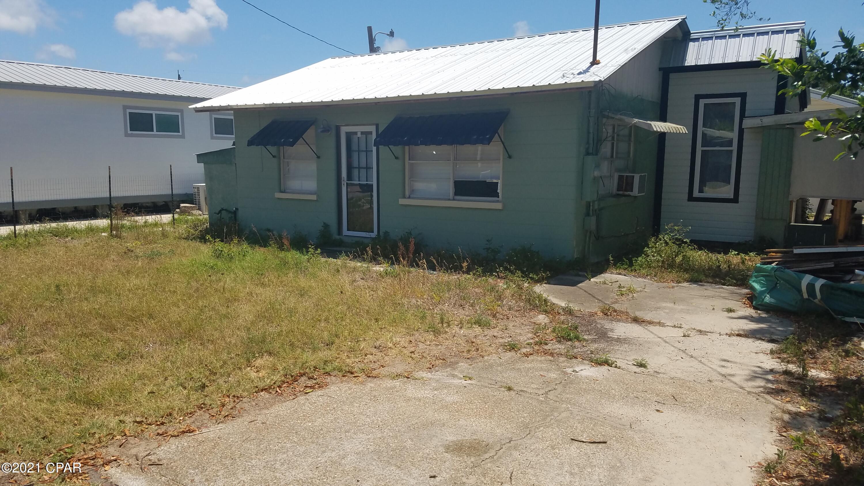Home is a perfect fixer upper!  Only 1 1/2 blocks to the beach!   This home is being sold AS IS.  Seller does not live in home and does not warrant any of the home.  Laguna Beach is one of the most desirable beaches in the area.  Take your golf cart to go grocery shopping at the oldest grocery store on the beach, The Carousel. Or, grab a quick lunch or breakfast at Thomas Donuts.  All within a few blocks.