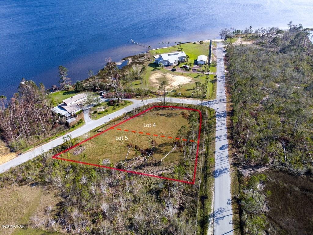 This is an incredible opportunity for stunning water views! This home site is almost a half acre, and it is just steps to a public launch for bay and gulf access! The adjacent lot is also available for purchase for those interested in building an estate-sized compound!
