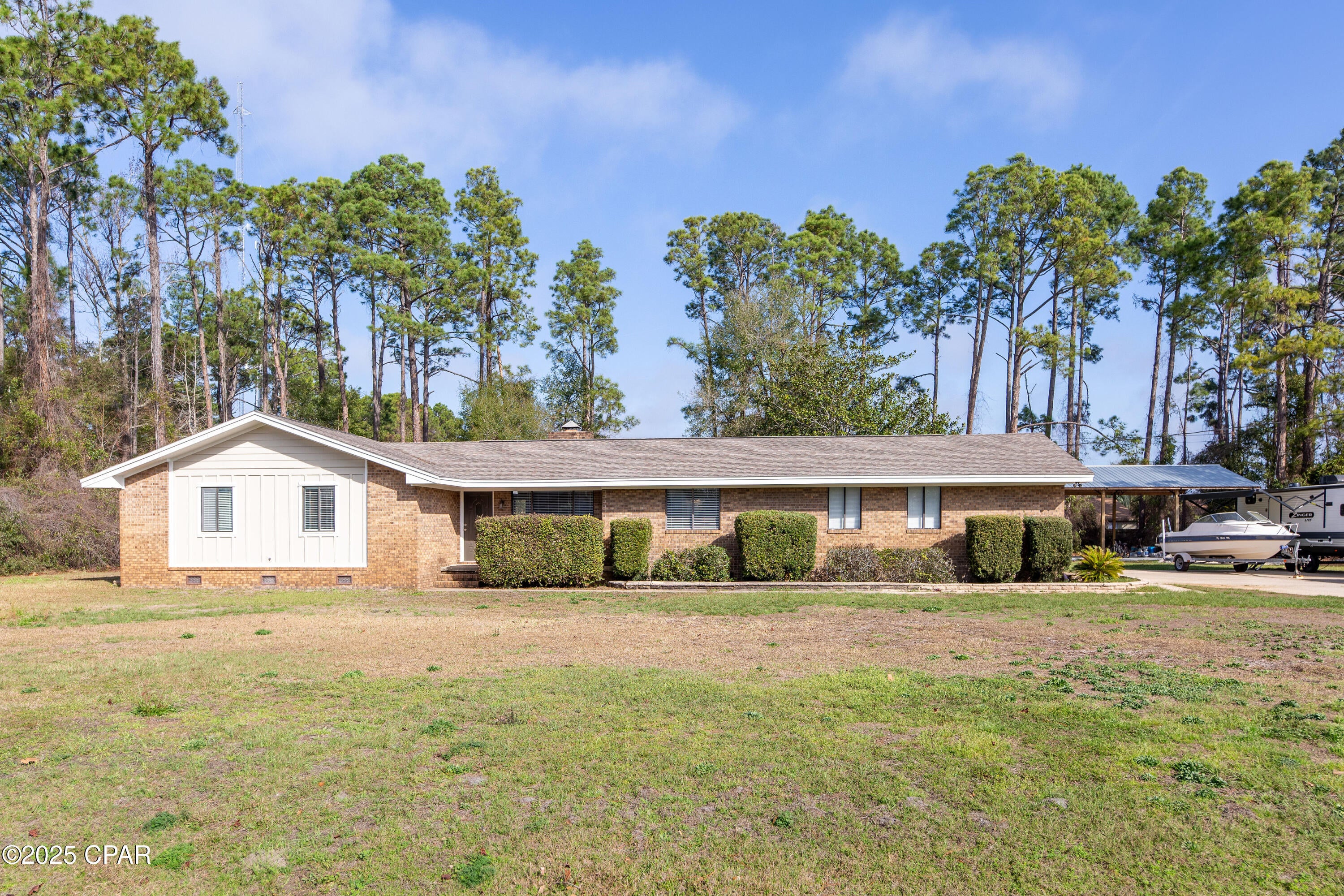 Currently under contract, Seller will consider backup offers. Priced for a quick sale! It is nearly impossible to find a lot of this size on Panama City Beach, don't miss this rare opportunity to own a partially renovated home on 1.16 acres in the heart of Panama City Beach! Offering a blend of privacy, space, and potential, this property is perfect for those looking to customize their dream home or enjoy a private retreat just minutes from the beach. This home has a solid start with updated flooring in some areas and additional improvements throughout, ready for your finishing touches. Ask your agent for the full list of work that has already been performed. 
Enjoy the tranquility of a private setting with no HOA, while being just a short drive from beaches, shopping, dining, and top local attractions. Whether you're looking for a fixer-upper with land and potential or an investment opportunity in one of Florida's most desirable areas, this unique property is a must-see!