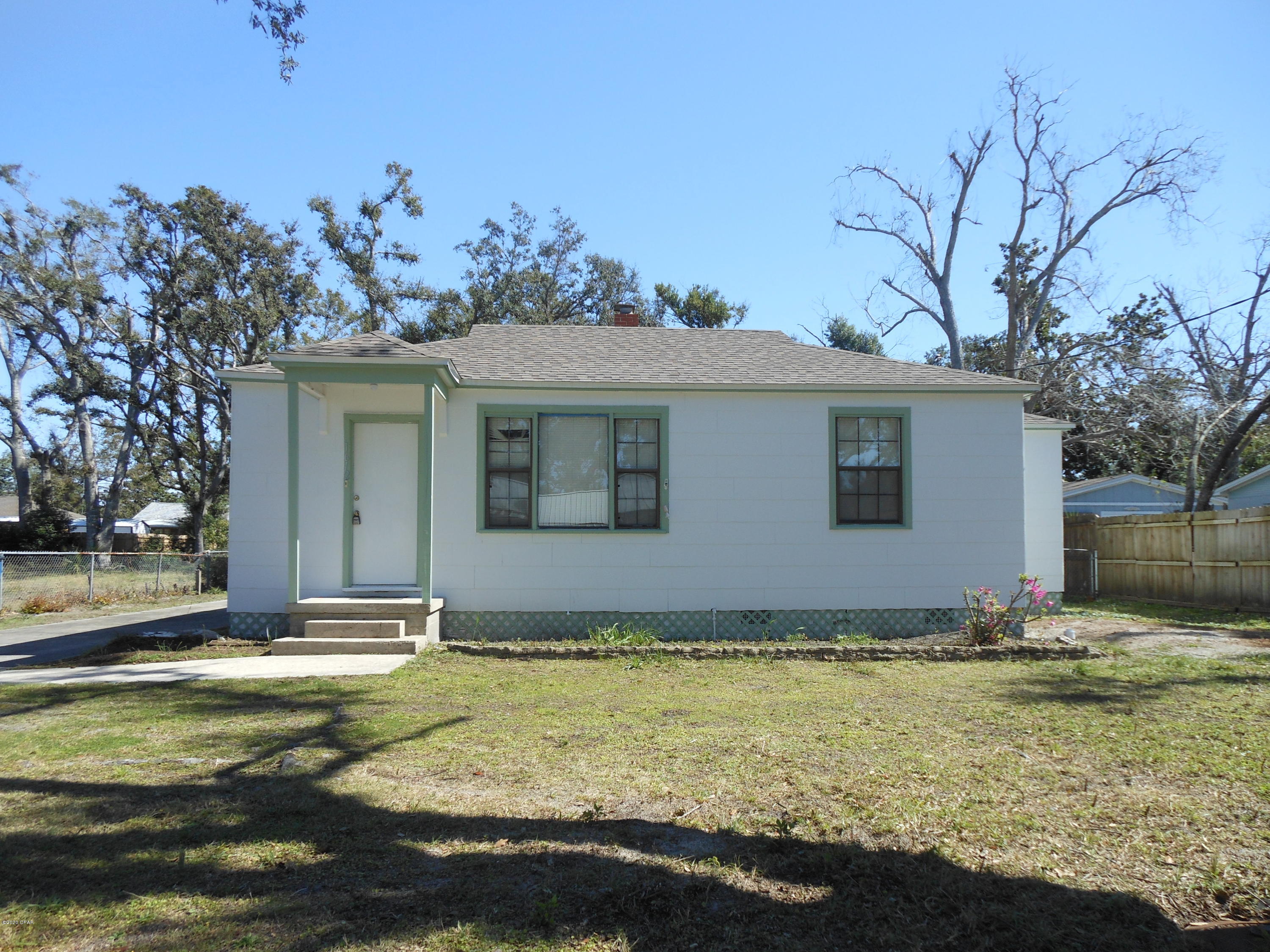 Two bedroom, one bath home with living/dining area, den and detached one 1 space detached garage used for storage.