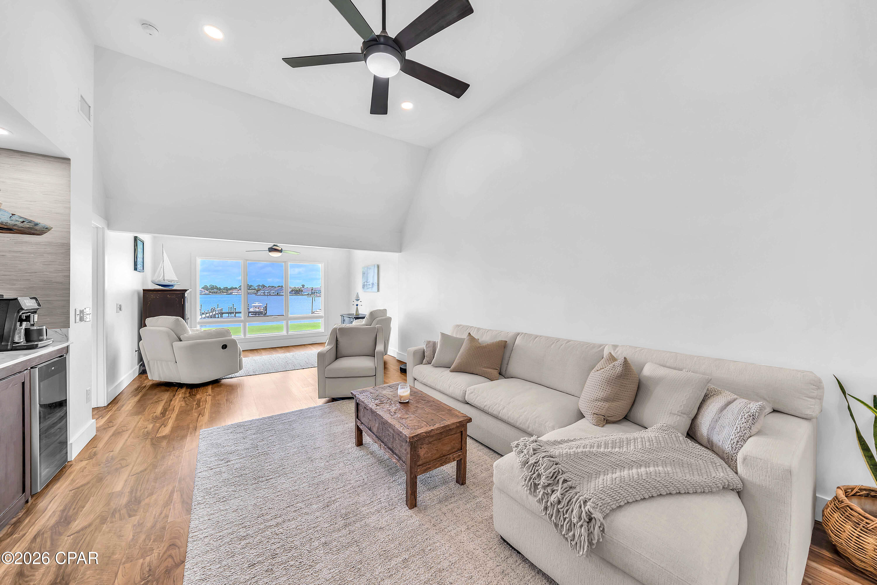 Experience the best of waterfront living in this highly sought-after Turtlegrass Villas in Bay Point, gorgeous inside and out!  This completely renovated private end unit is an exceptional 2-bedroom, 2-bath waterfront property with breathtaking panoramic views of the Bay and Lagoon.  You literally have views from every room - even the kitchen windows! Floor-to-ceiling windows in the living room showcase the stunning views and flood your home with natural light.  Turtlegrass owners enjoy access to 3 private docks, providing the rare convenience of keeping your boat just steps from home, along with opportunities for fishing and enjoying the beautifully maintained waterfront grounds. Inside, the open-concept split floor plan has been thoughtfully designed with luxury finishes throughout. The spacious primary suite features quartz countertops, dual vanities, a tiled walk-in shower, and a generous closet. The bright kitchen and dining area overlooks the Bay Point Golf Course, and your beautifully updated kitchen offers white shaker cabinetry, quartz countertops, and a center island perfect for gathering. Soaring ceilings highlight the living room, complete with a wet bar and spectacular water views, creating an ideal space for entertaining. A cozy nook provides additional seating and the perfect spot to relax while watching dolphins play and boats enter the marina. The guest suite offers its own floor-to-ceiling windows, walk-in closet, and a spacious ensuite bath with quartz countertops and a tiled tub/shower combination. This residence has been completely gutted and renovated from previous owner, including electrical, plumbing, sheetrock, flooring, and more. Additional features include a private courtyard entrance with patio and room to grill, outdoor storage closet, interior foyer storage, and utilities included except electricity and internet. Located within the prestigious gated Bay Point community with 24-hour security, residents enjoy access to a championship golf course and a full-service marina, on-site dining, all conveniently located near Panama City Beach attractions, shops and restaurants, St Andrews State Park, Navy Base, as well as boating and the beach!   Make this exceptional property your new home, vacation home, or vacation rental - call today!