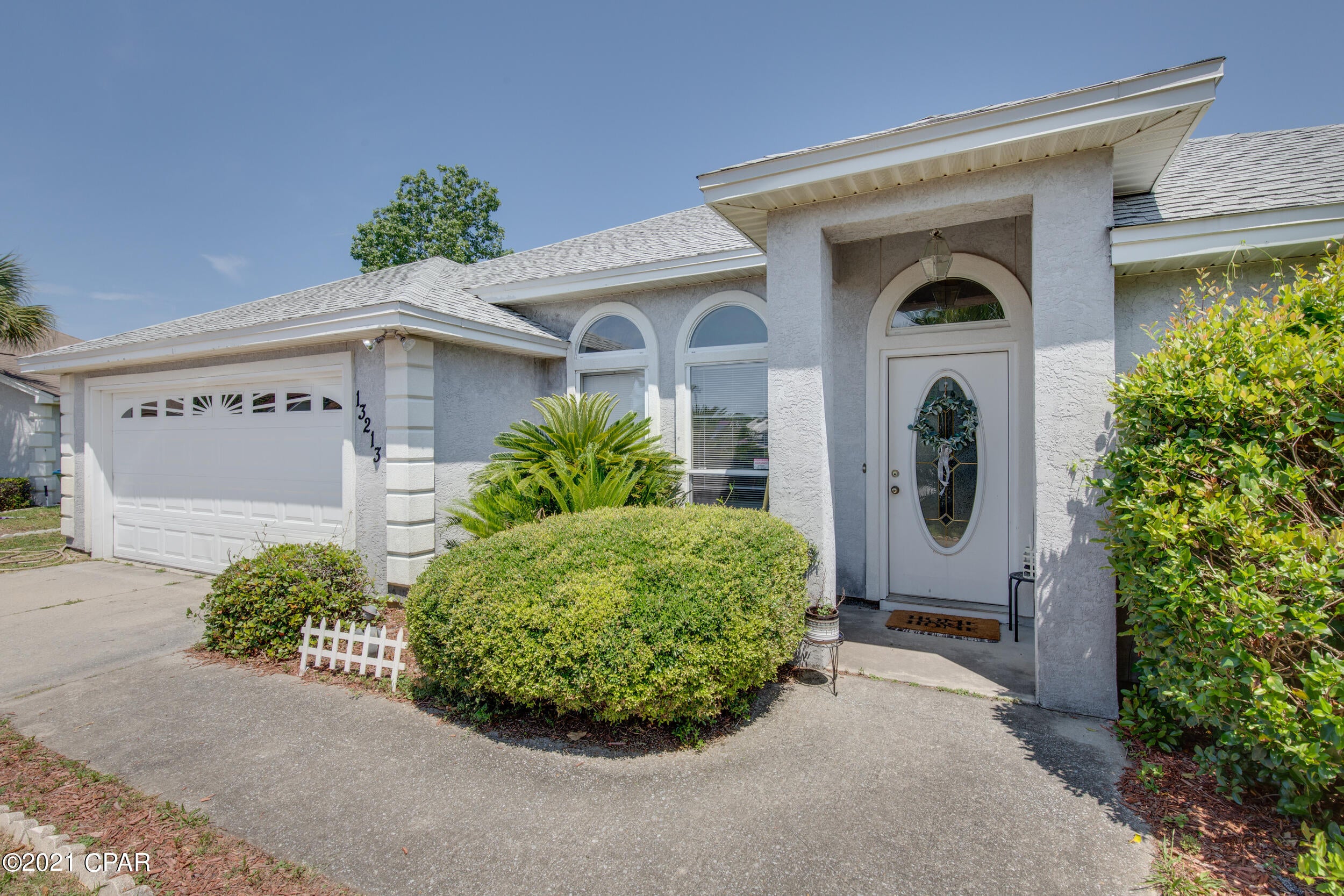 CURRENTLY UNDER CONTRACT, SELLER ACCEPTING BACKUP OFFERS. On a cul-de-sac at the end of cute Fernwood Place, this 3BR/2BA features an oversized lot with plenty of room for a pool. It is centrally located in PCB, and best of all, is within walking distance to the beach. This split bedroom floor plan features plank flooring in the bedrooms and tile everywhere else, 10' ceilings in the living room, dining room and kitchen and a trey ceiling in the master. All of the rooms have loads of light coming and there is plenty of parking outside the two-car garage for guests or additional vehicles. Enjoy the outside on a nice sized patio overlooking the huge lot and take comfort in lower water bills with a pump for the irrigation system. Roof and irrigation pump are approximately two years old