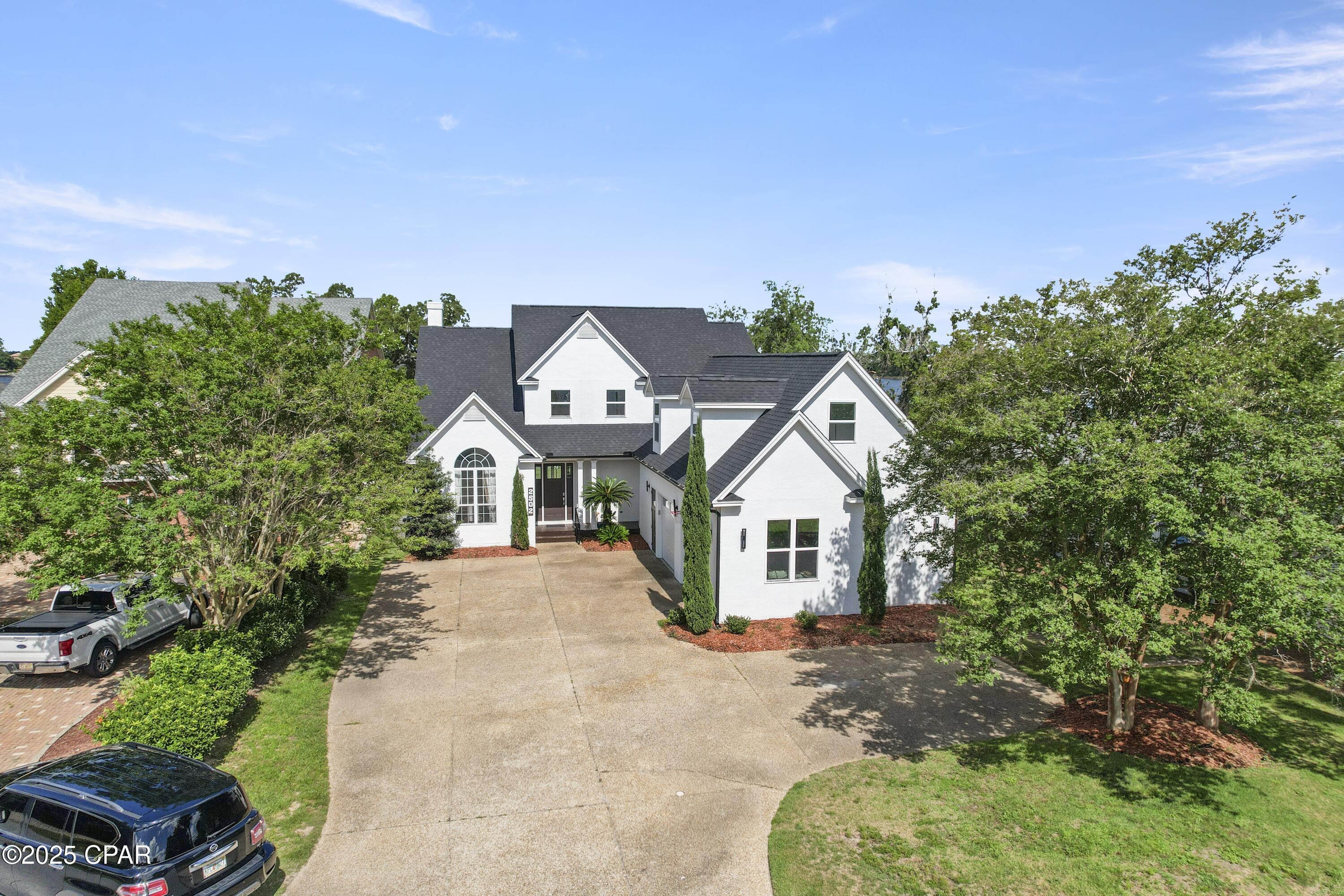 Refreshed Lynn Haven bayou front home with North Bay views offering access to the Gulf of Mexico located in Panama Country Club, now private! The kitchen is a dream for entertaining, featuring a spacious open floor plan with a great view of the water. Stunning Quartzite countertops imported from Brazil add elegance and durability- it's one of the hardest natural stones, ensuring lasting beauty and performance. The main living area overlooks the water with a large back porch once again great for entertaining and gathering after a day of boating.
Master bedroom and bath downstairs along with  another room that would make a great new born bedroom which would be great for security and convenience, another 2 bedrooms up stairs with two additional rooms for game room/theater room or additional bedrooms. Off of the bonus rooms is access to the garage with a staircase, This feature is great for entering and exiting the home without interruptions. This home is very unique and is a must see!///Bring you large sailboat or motor boat --- extra deep water /bayou near North Bay--located in Panama County Club-Lynn Haven//Great location--on east side of Country club---Home has sea wall --dock--2 car garage. EXPERIENCE THE BEST OF  GOLFING AND WATERFRONT LIVING IN THE HIGHLY DESIRABLE CITY OF LYNN HAVEN FL.
Total square footage is 4,300+_ . All measurements are approximate and should be verified by the buyer.