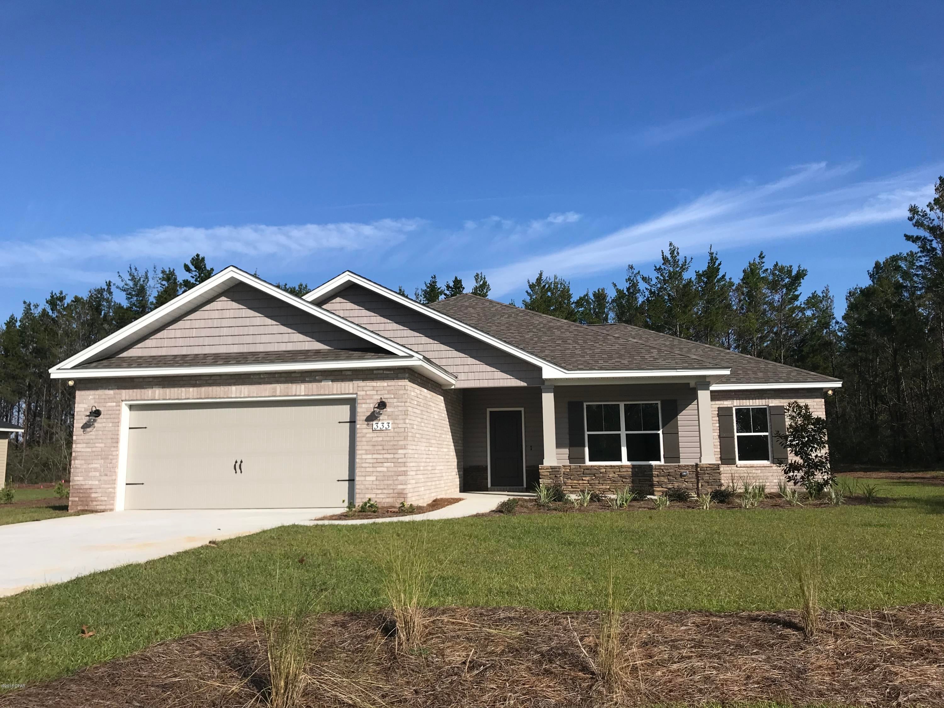 NEW CONSTRUCTION 4/2 ON 1 FULL ACRE LOT-easy access to Panama City & Lynn Haven's main shopping corridor, Tyndall AFB, and the Naval Coastal Systems Base. Interior of home offers upgraded lighting fixtures, super durable laminate wood flooring, large living room and dining room, kitchen with locally built cabinets, solid surface counter tops, large island, unique accent lighting and stainless steel appliances,large Master Suite, convenient linen closet and walk-in master bath closet, recessed lighting and crown moldings. Exterior features large lot, two car garage, partial sodded yard with sprinkler system and covered porch, brick and vinyl. Please verify all measurements and other listing information if important.