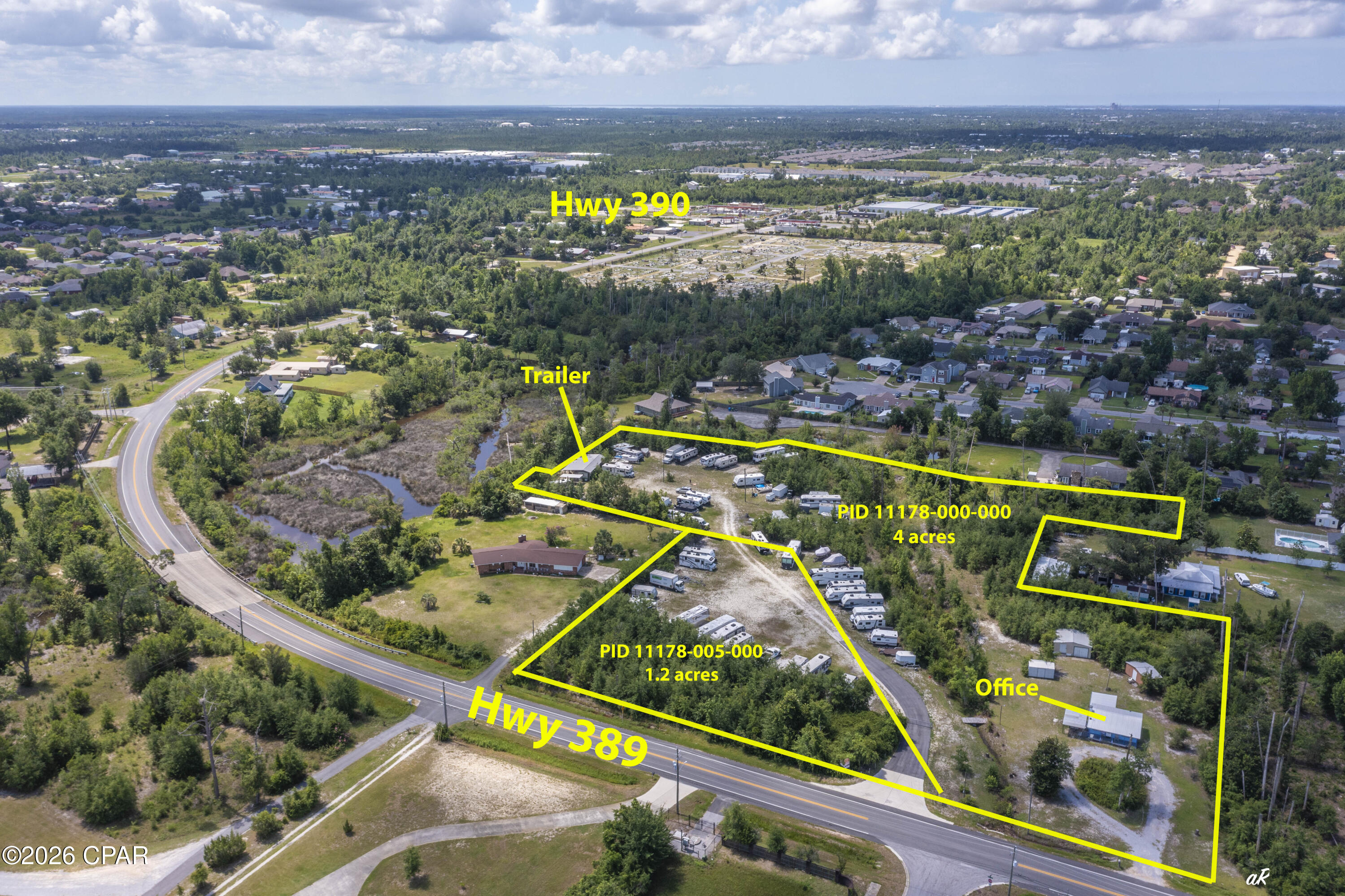 Lynn Haven ... Parcel 11178-000-000. 3 income producing properties to include RV/Boat Storage.  RV & Boat Storage Business has a Conditional Use Permit with Bay County that is transferrable. ... approx. 96 spaces.  2/1 Covered Mobile Home on stream that leads into Beatty Bayou that leads into Bay.  A small house facing Hwy 389/12th St that has been used as an office. There are 3 nice storage units in back of house.  1.  15' x 10' with electricity and wall AC.  2.  Is divided into 2 units 11' x 19'.  Right side has a pull up garage door with code for access.  Unit has electricity and sits on concrete slab.  Has wall A/C.  Also houses a John Deer zero turn riding lawn mower, walk behind self-propelled mower and a walk behind weed eater as well as some miscellaneous tools. 3.  11.8 'x19'.  There are two wells on property. The one next to the blue house is a shallow well for flushing toilet, washing, etc.  The well is a deep well and provides water to a 50 x 10, 2 bedroom/1bath mobile home located at the back of parcel 11178-000-000.  A new metal roof was installed on blue house after Hurricane Michael.  Blue house has 4 wall/window ACs.  With a bit of TLC this could be fixed up and rented.   Entire properties have excellent location to Mowat Highlands, College Point, Derby Woods, the Hammocks and many other nice subdivisions in the area of Lynn Haven.  This is a great opportunity! Don't hesitate ... call today!